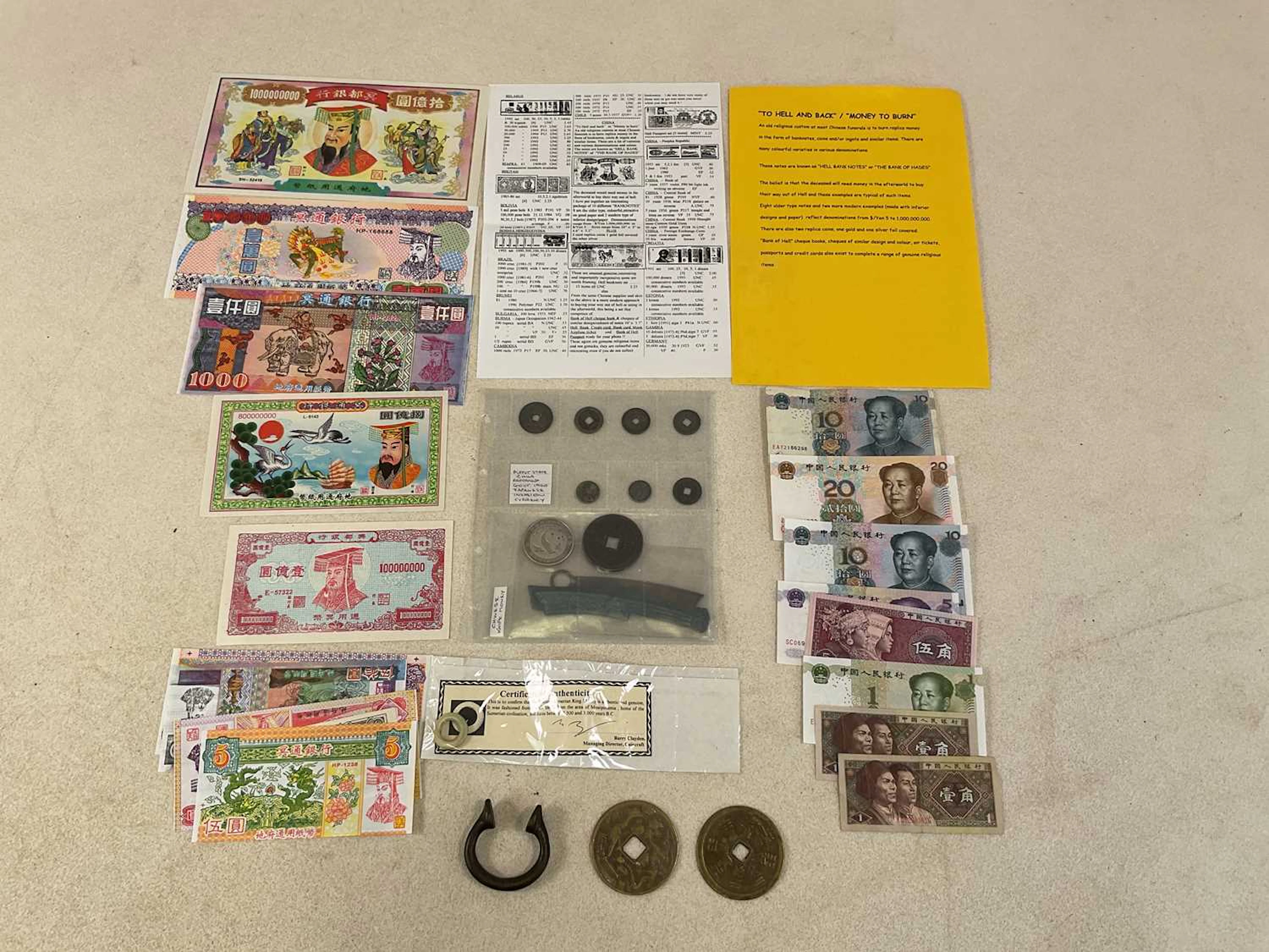 A small group of coins and banknotes comprising Chinese knife money