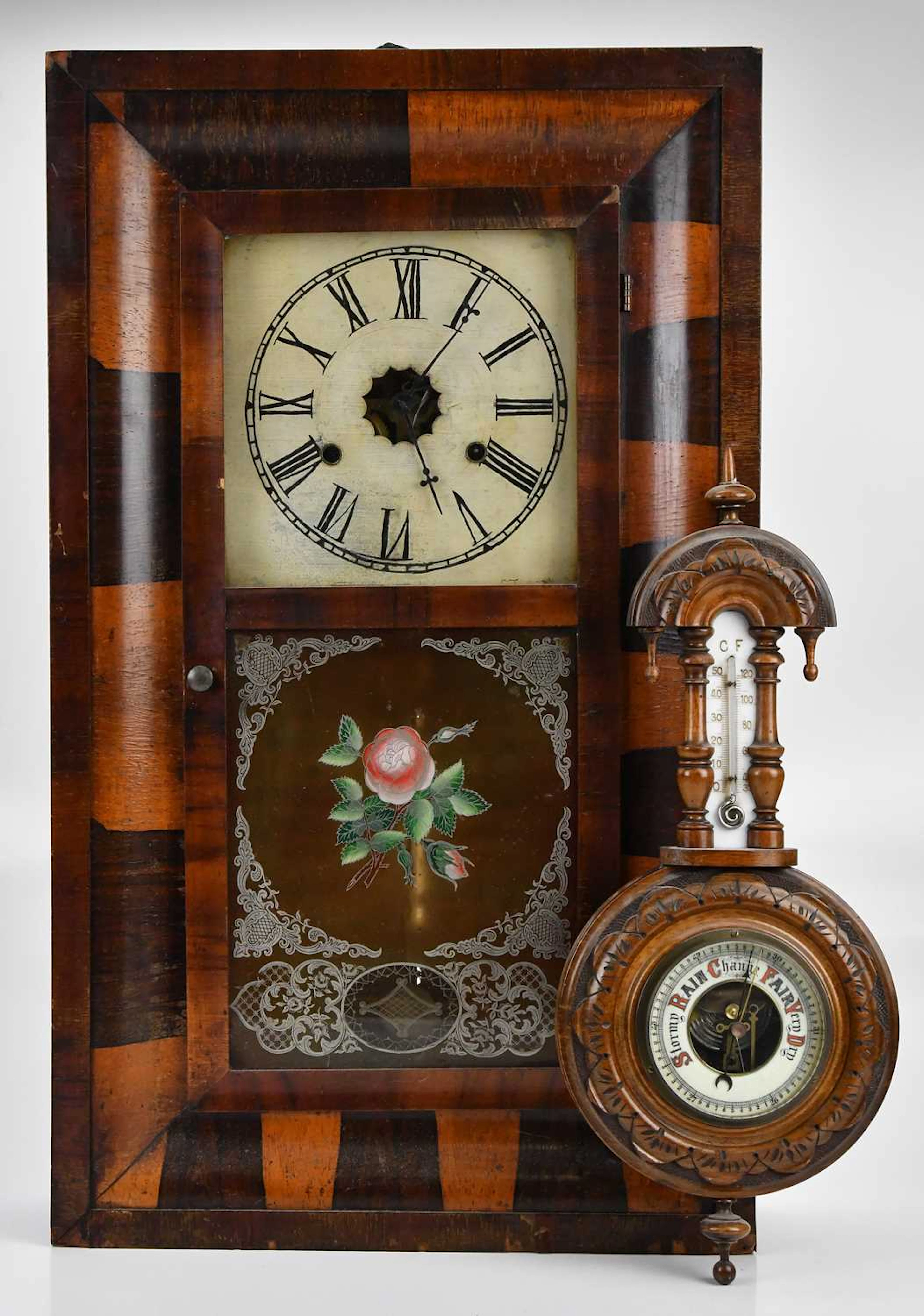 An early 20th century American rosewood wall clock