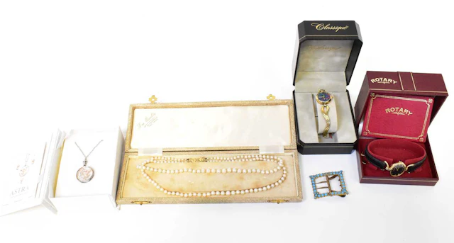 A cased double strand pearl necklace with 9K gold mount