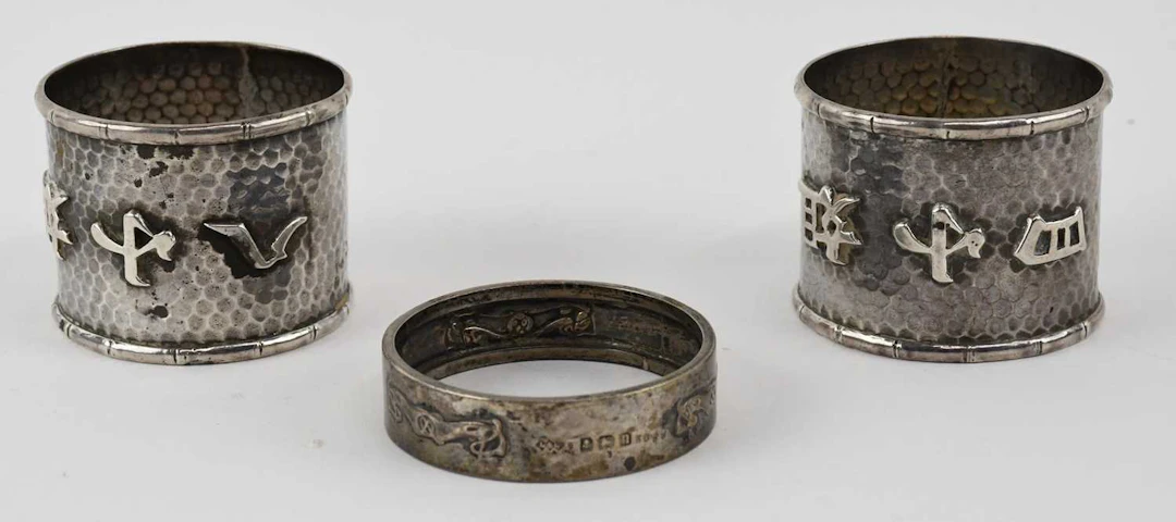 LIBERTY & CO; a George V hallmarked silver Art Nouveau napkin ring