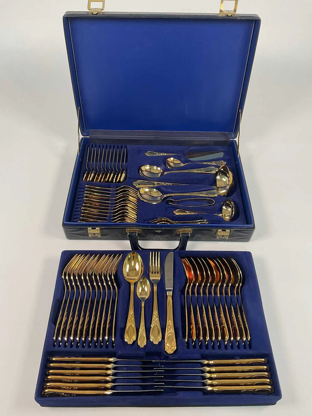 SBS BESTECKE SOLINGEN; a gold plated seventy piece cutlery set