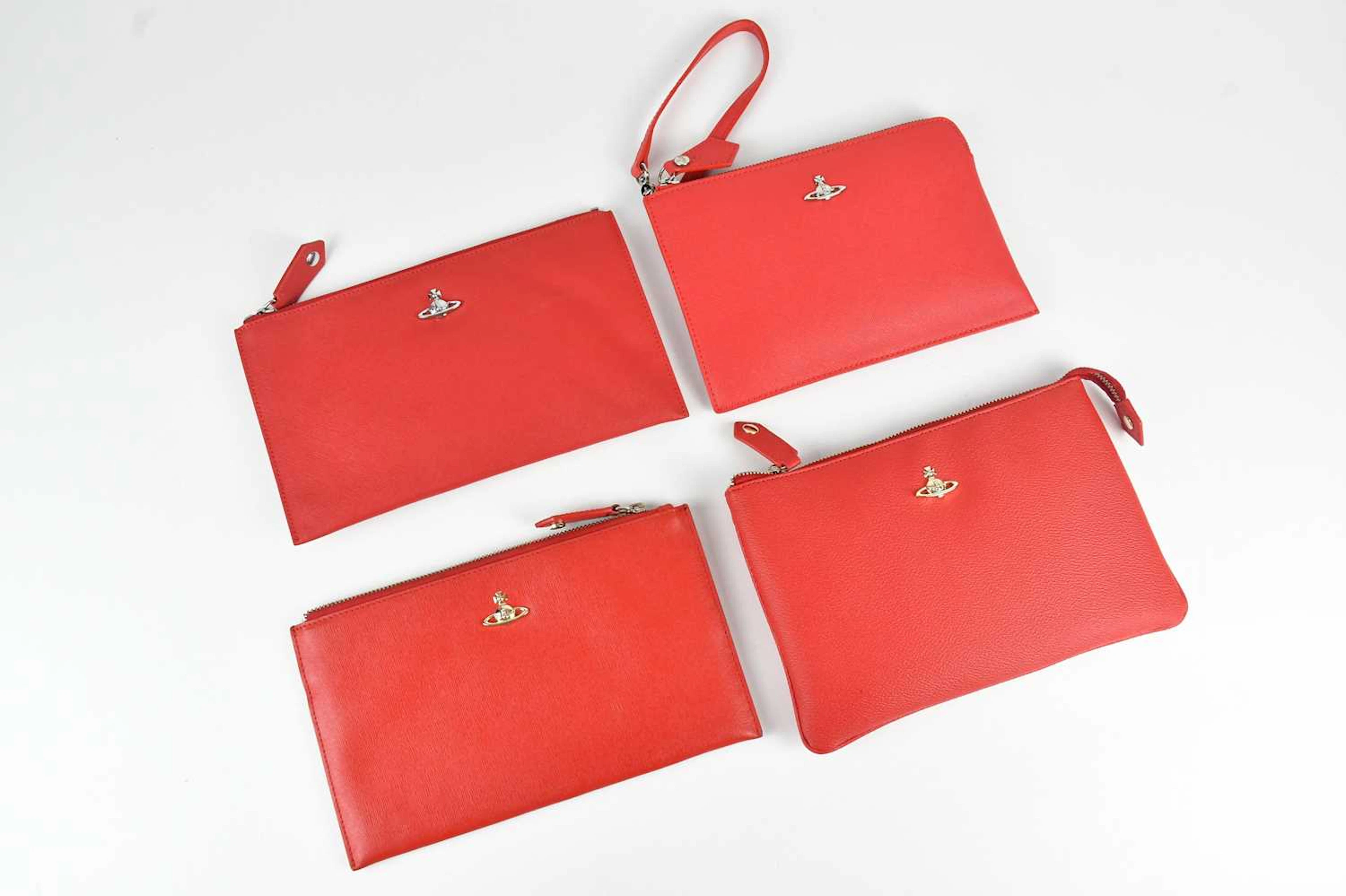 VIVIENNE WESTWOOD; a red pebbled leather pouch with gold...