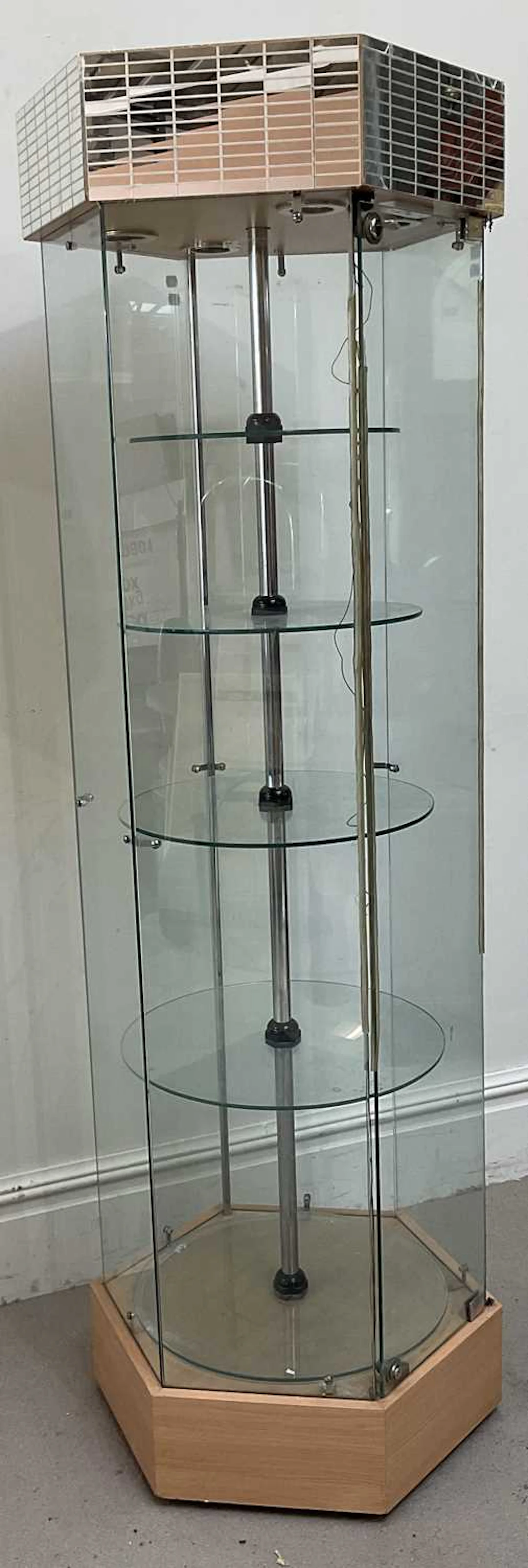A modern hexagonal revolving display cabinet