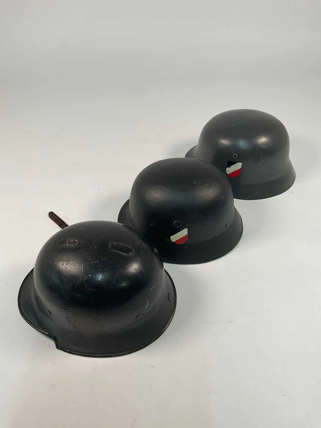 Three WWII German helmets