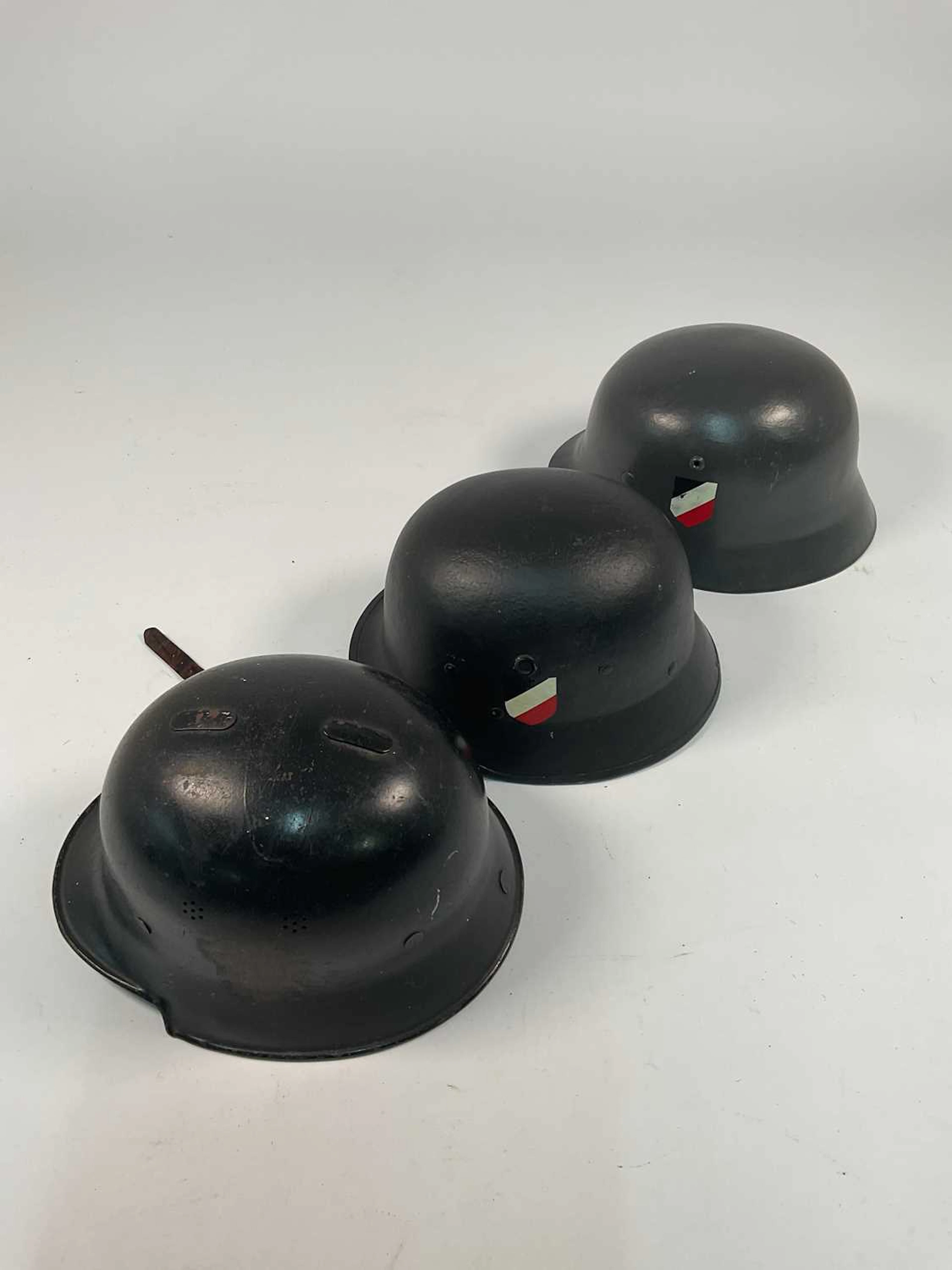 Three WWII German helmets
