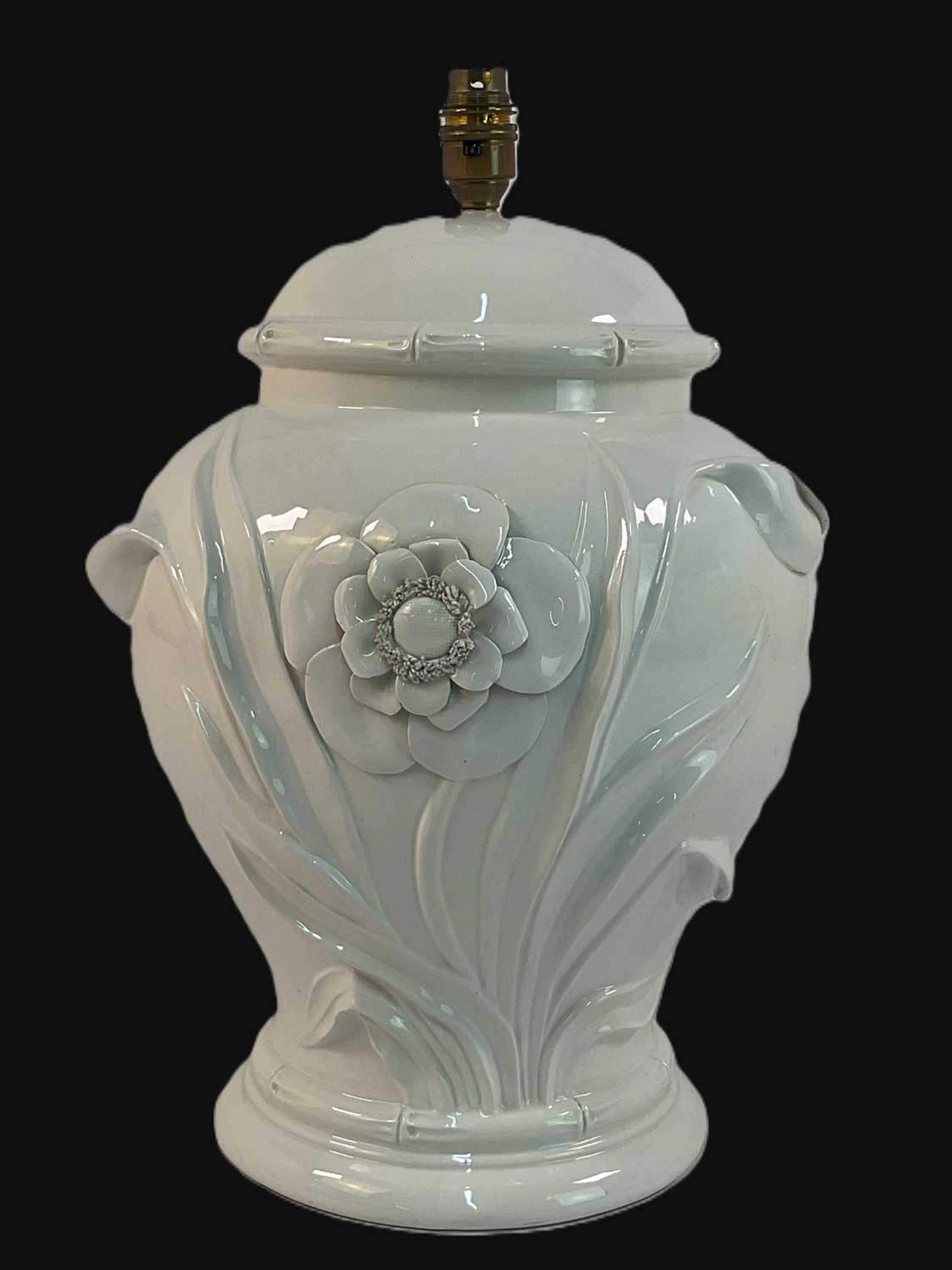 An Italian ceramic blanc de chine table lamp with raised...