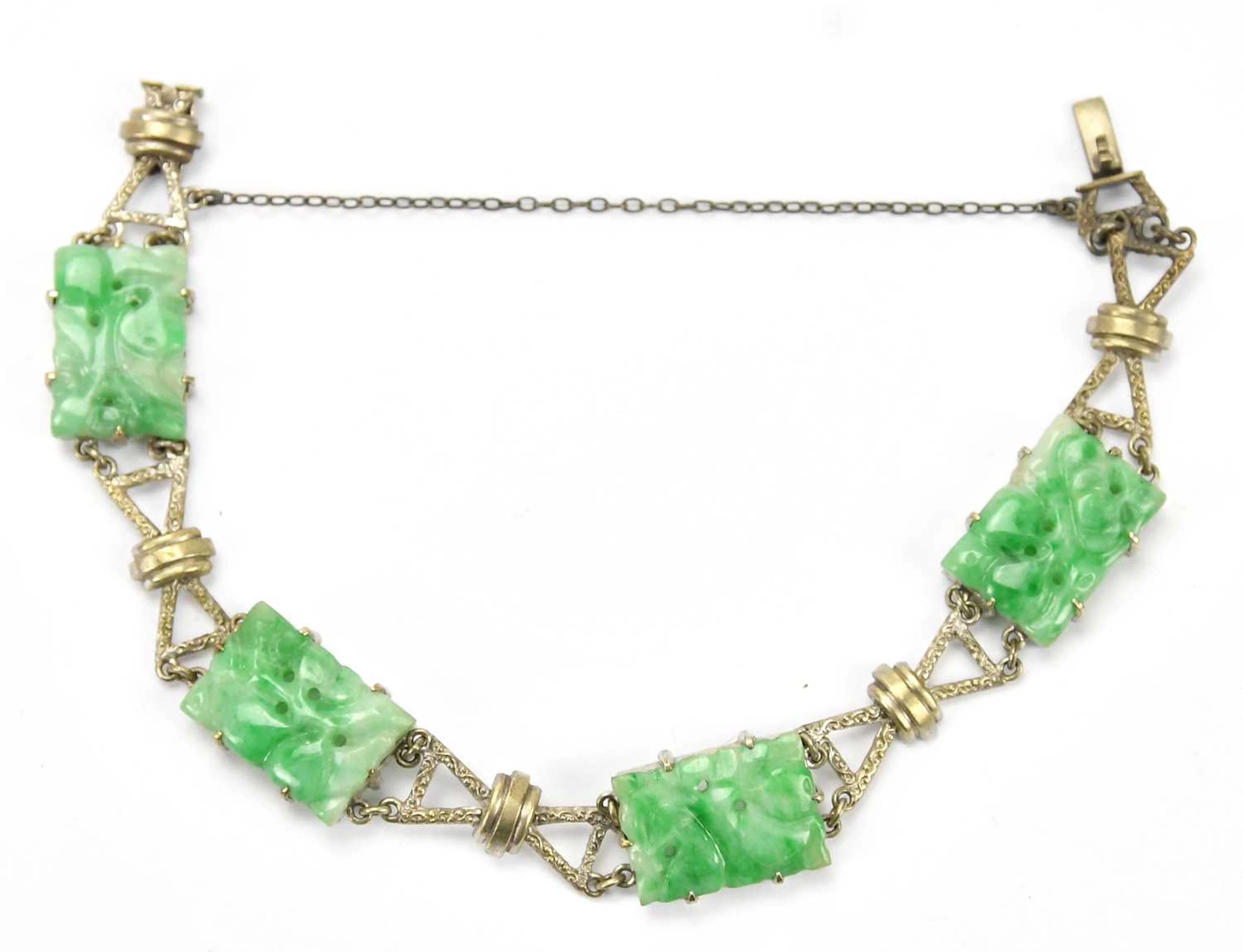 A Chinese white metal and green hardstone panelled bracelet
