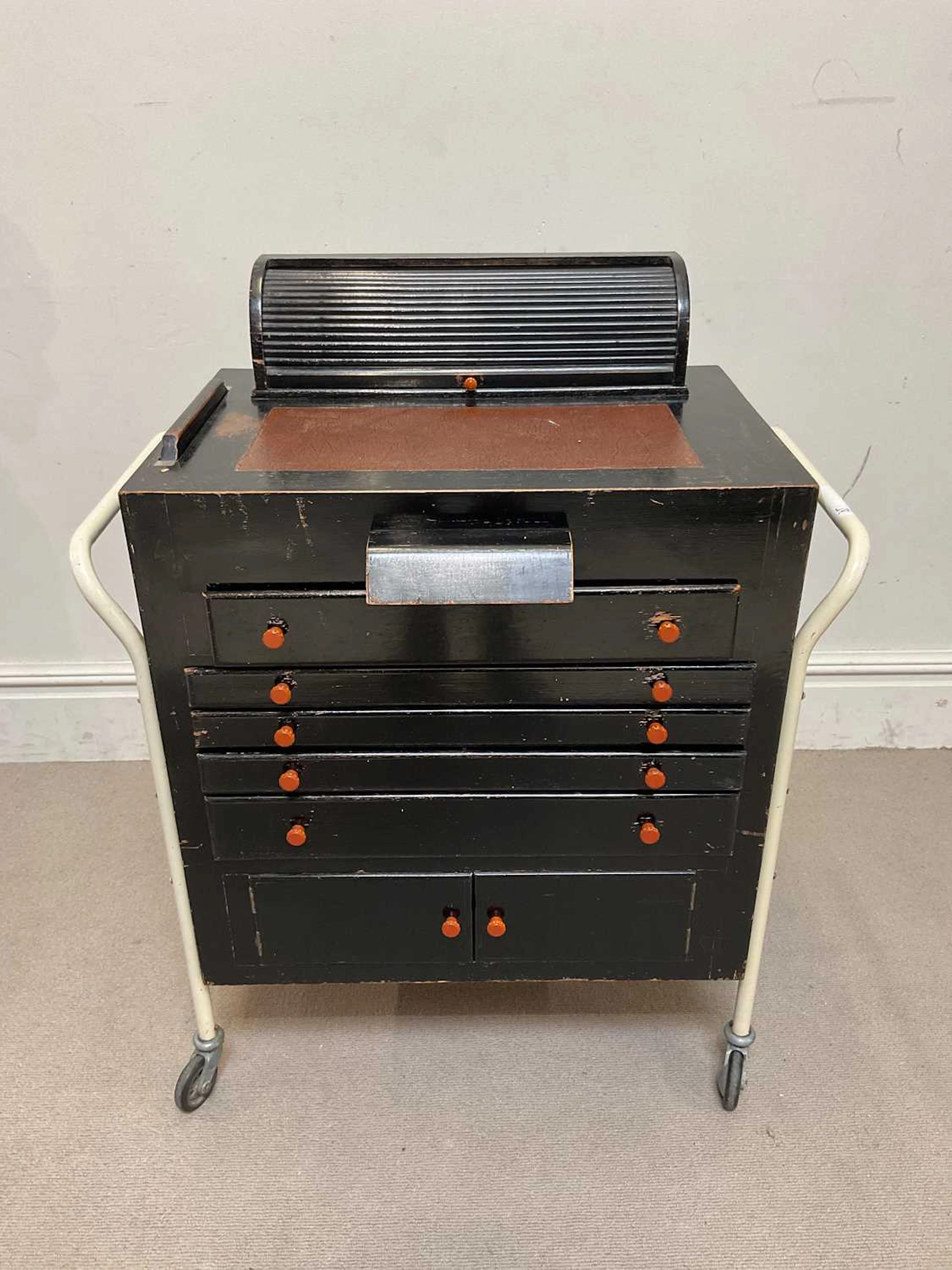 A vintage stained wood optician's chest