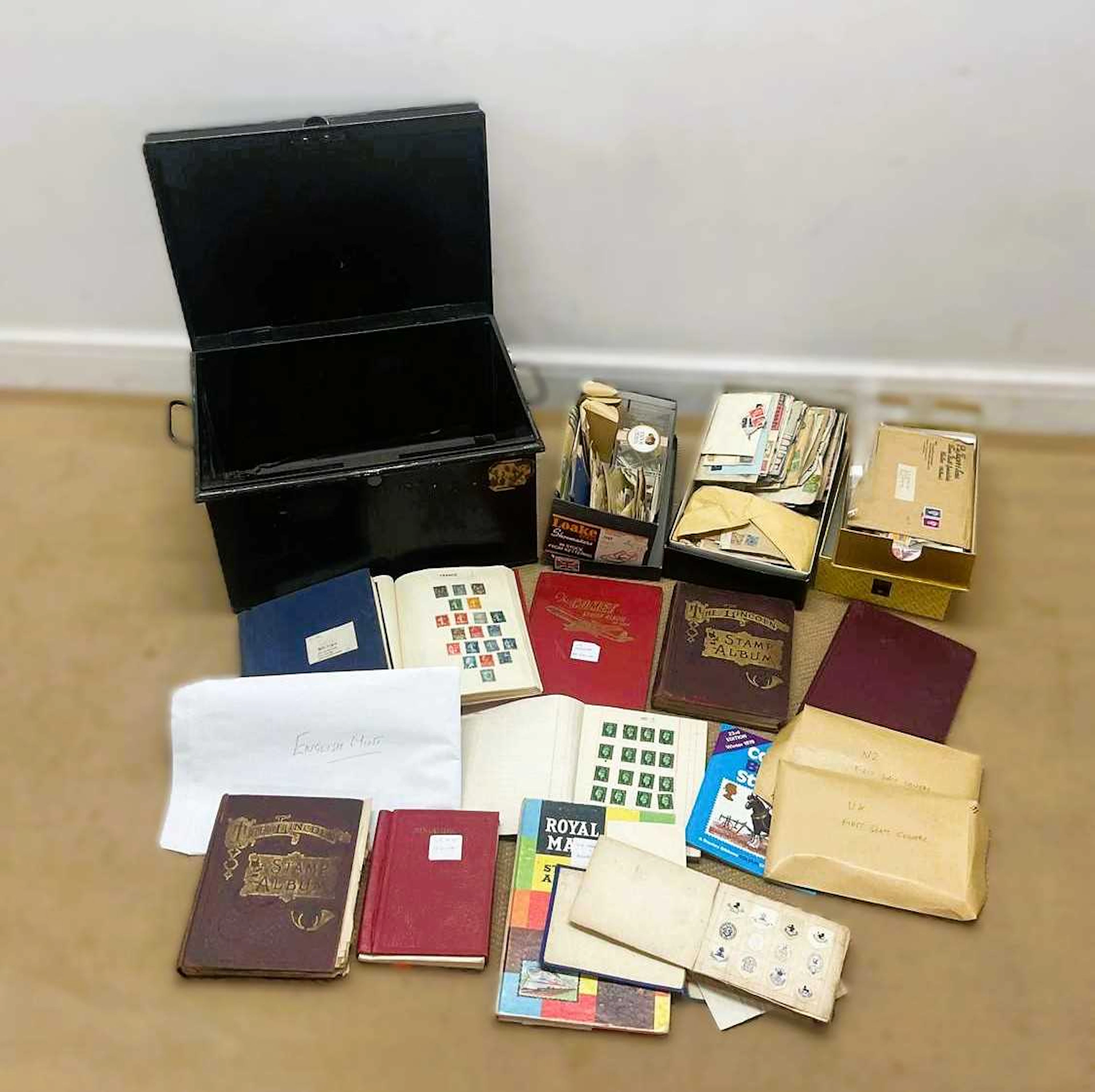 A collection of eight stamp albums