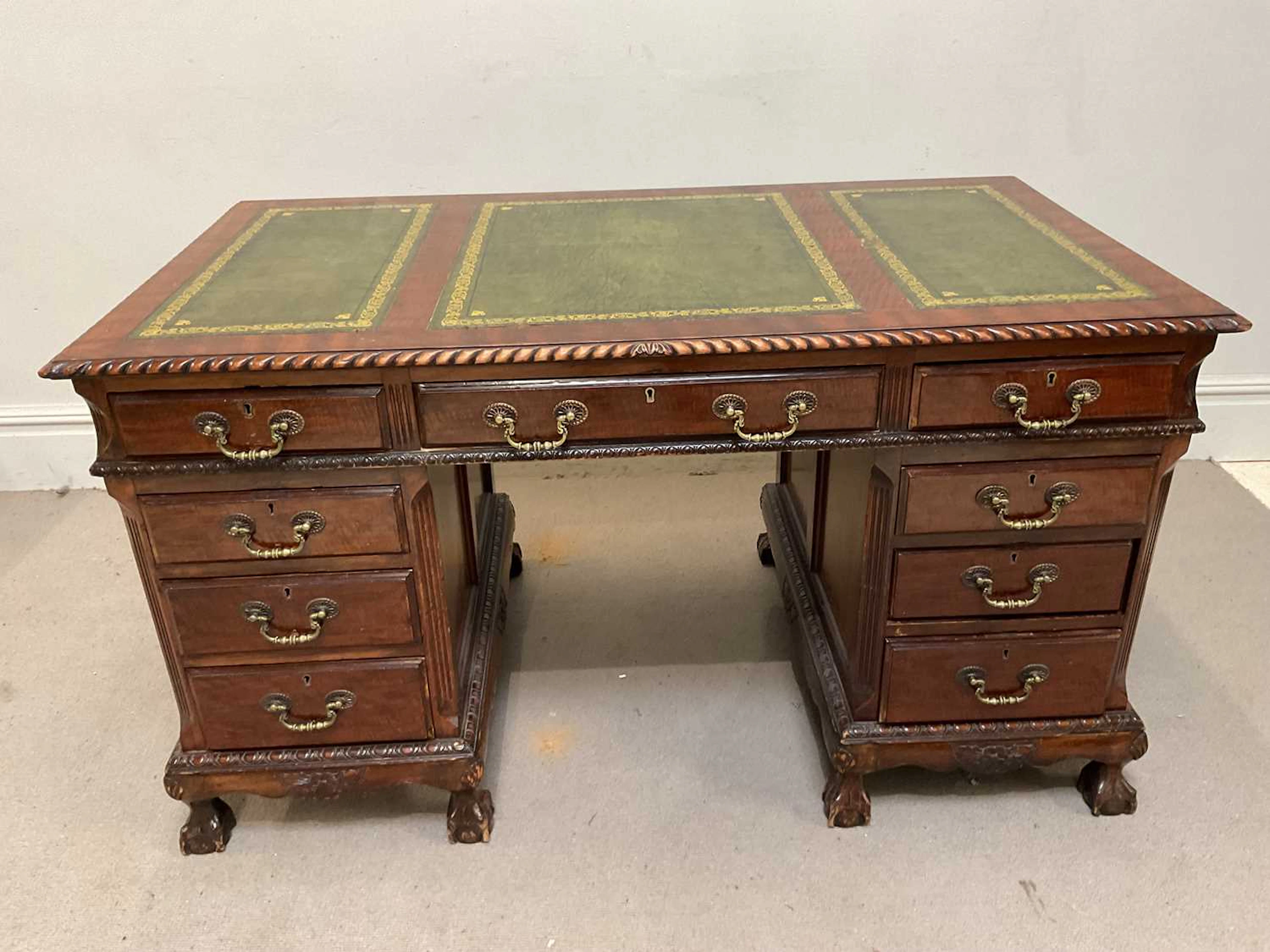 An early 20th century mahogany Chippendale style nine...