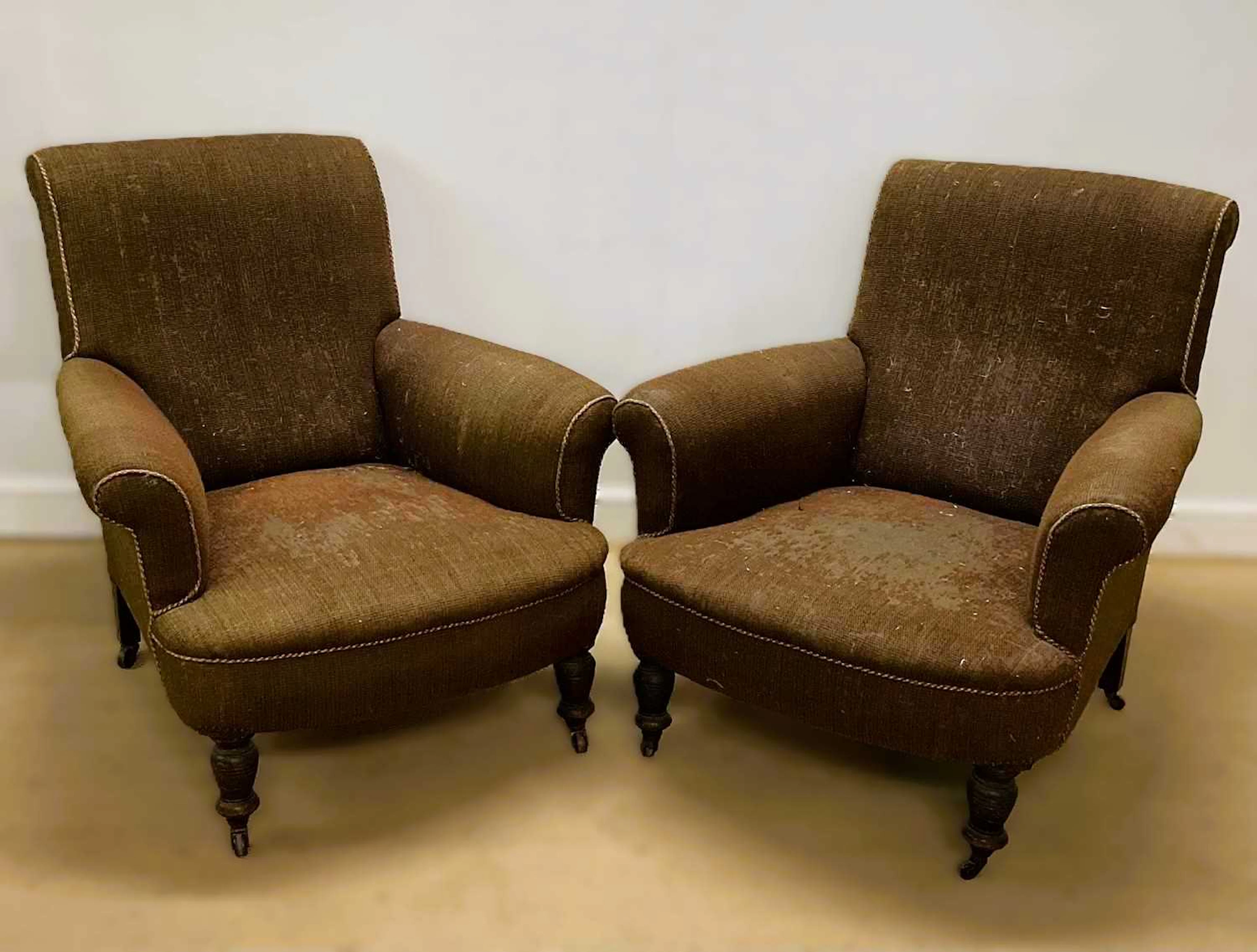IN THE STYLE OF HOWARD & SONS; a pair of upholstered...