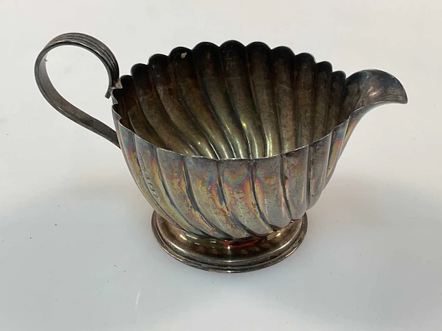 WILLIAM HENRY SPARROW; an Edward VII hallmarked silver cream jug