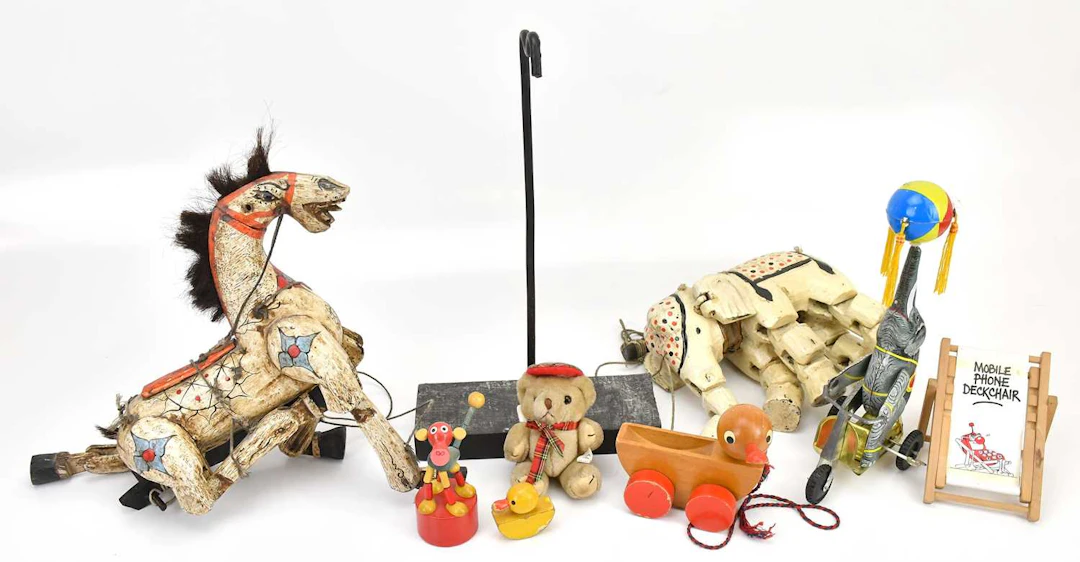 Two carved and painted wood puppets
