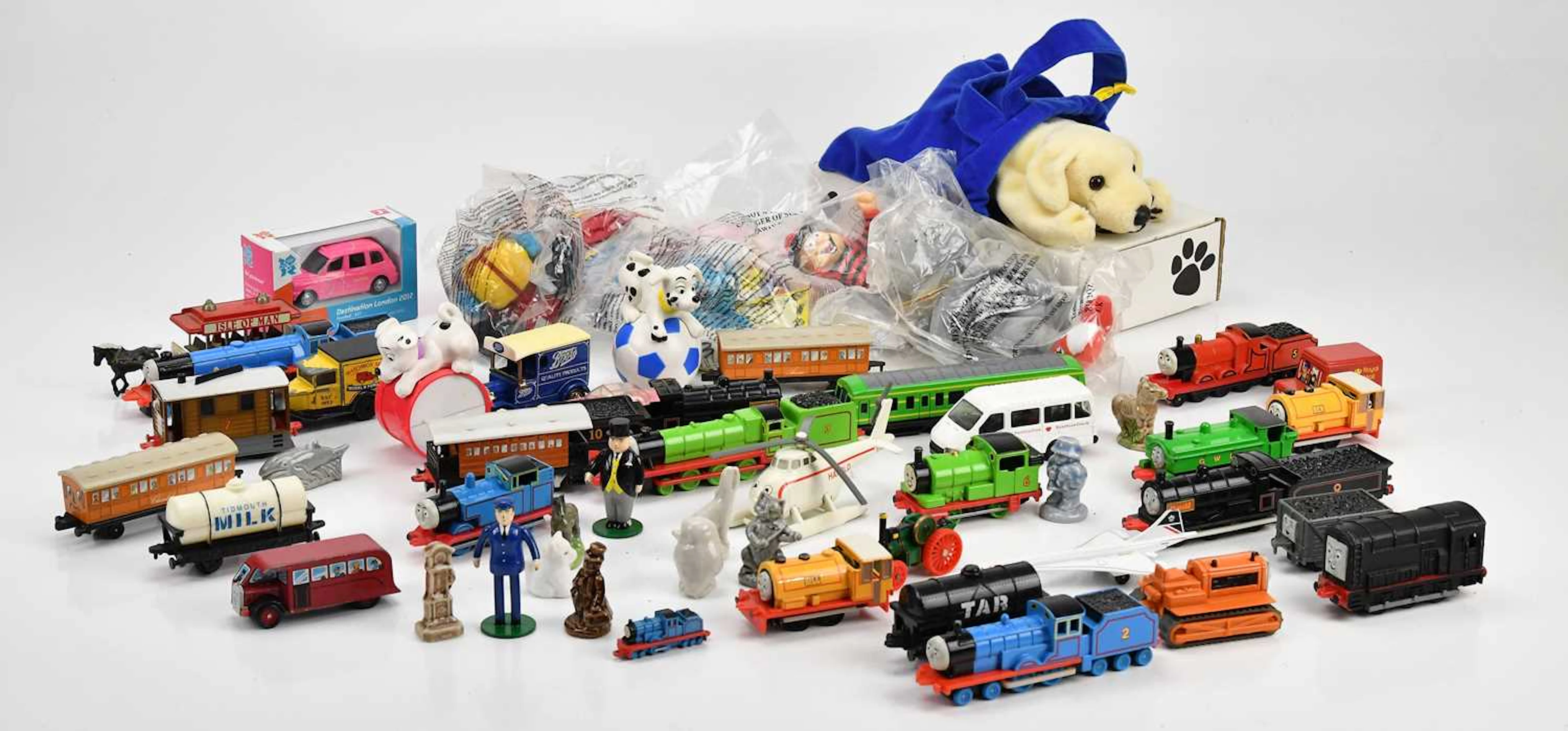 A collection of Thomas the Tank Engine toys