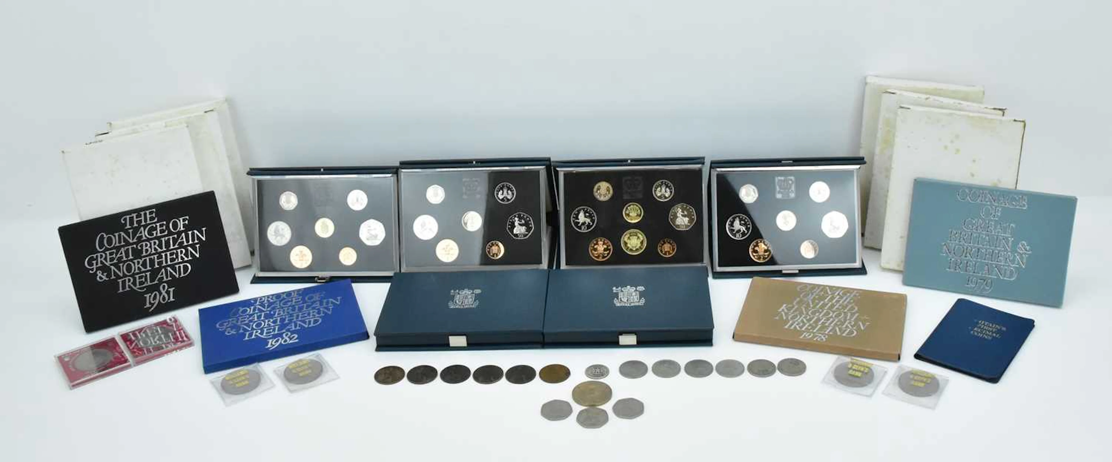 A quantity of UK collector's coins including two sets of...