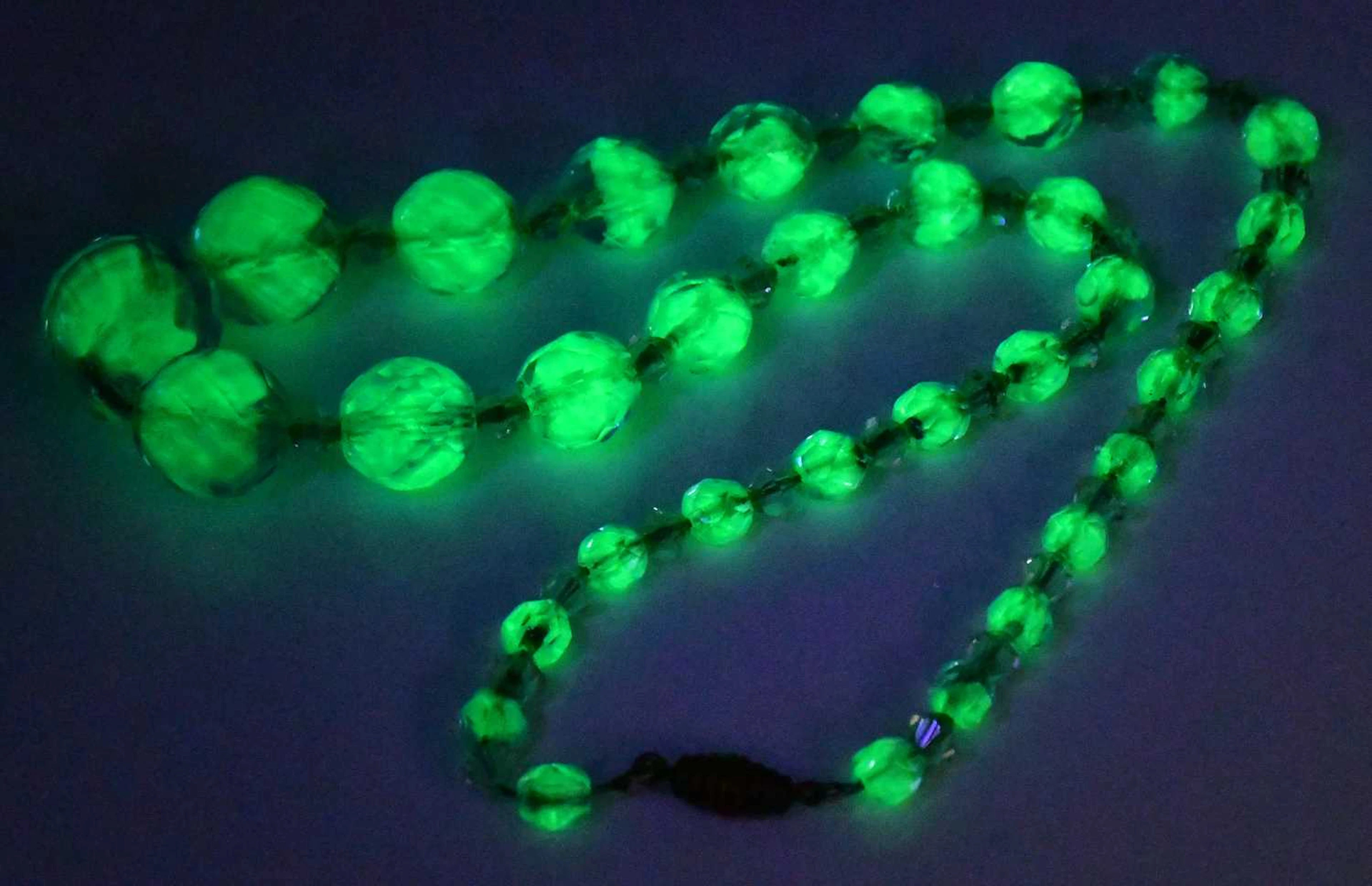 A single-strand blue and green Uranium glass and clear...