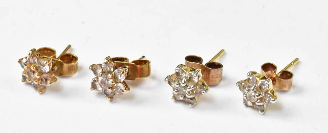 A pair of 14ct yellow gold flower head stud earrings set with diamonds