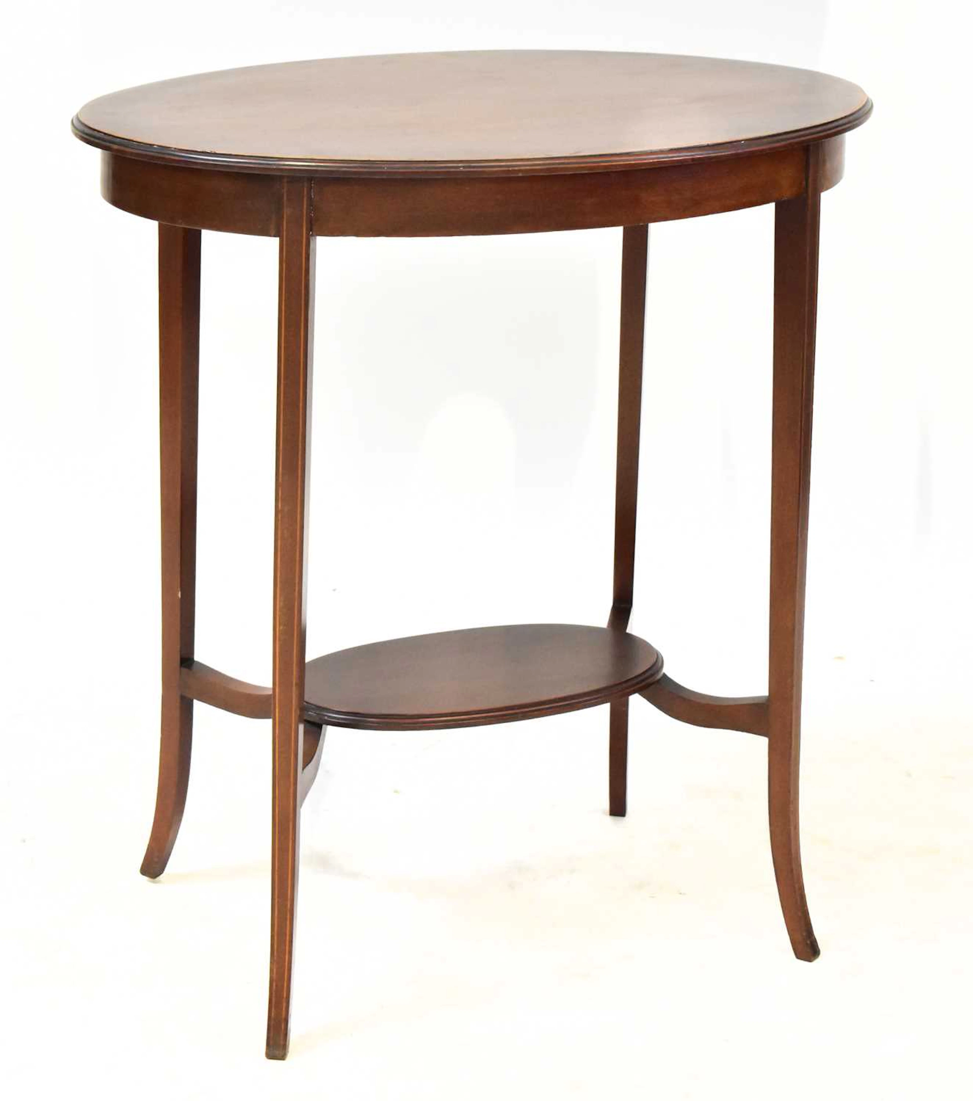 An Edwardian mahogany oval topped occasional table with an oval undershelf