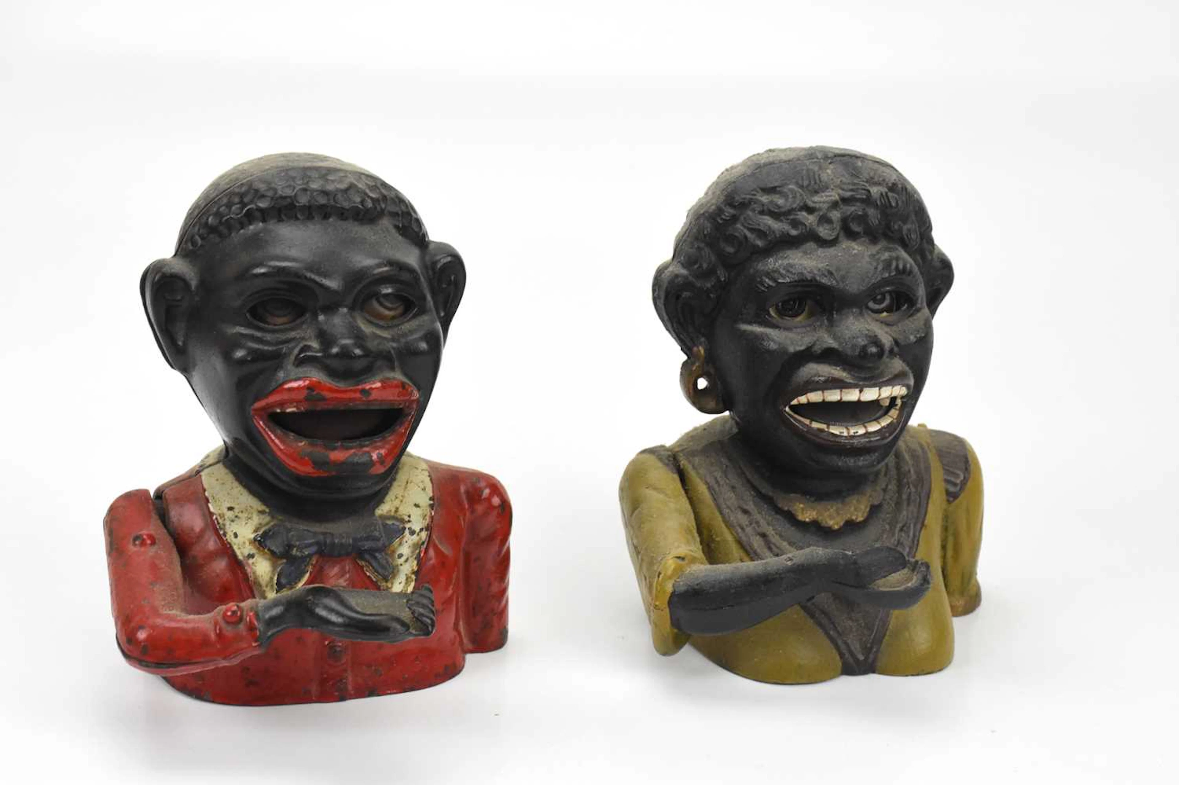 Two cast iron money boxes
