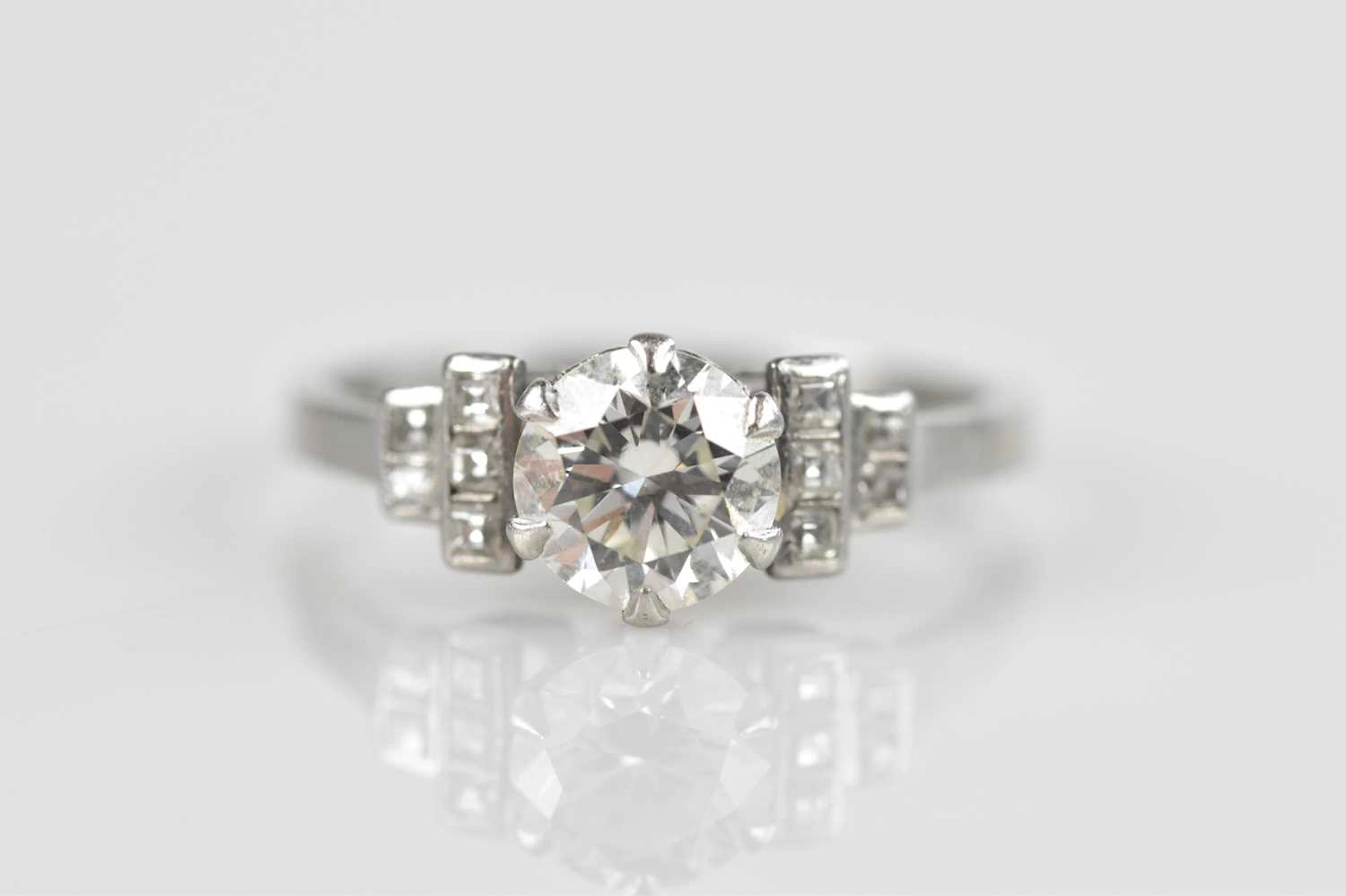 A platinum Art Deco diamond solitaire dress ring
