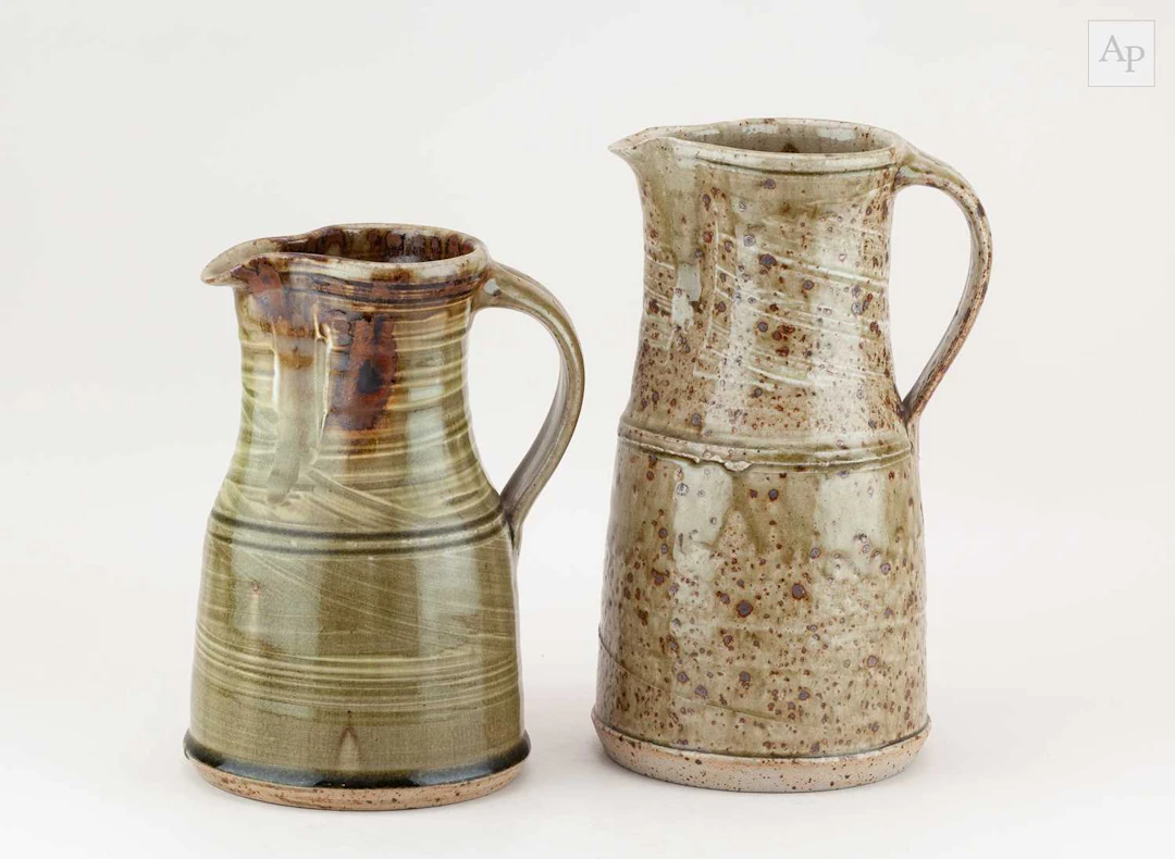 KEITH SMITH (born 1946); a stoneware jug covered in speckled green ash glaze
