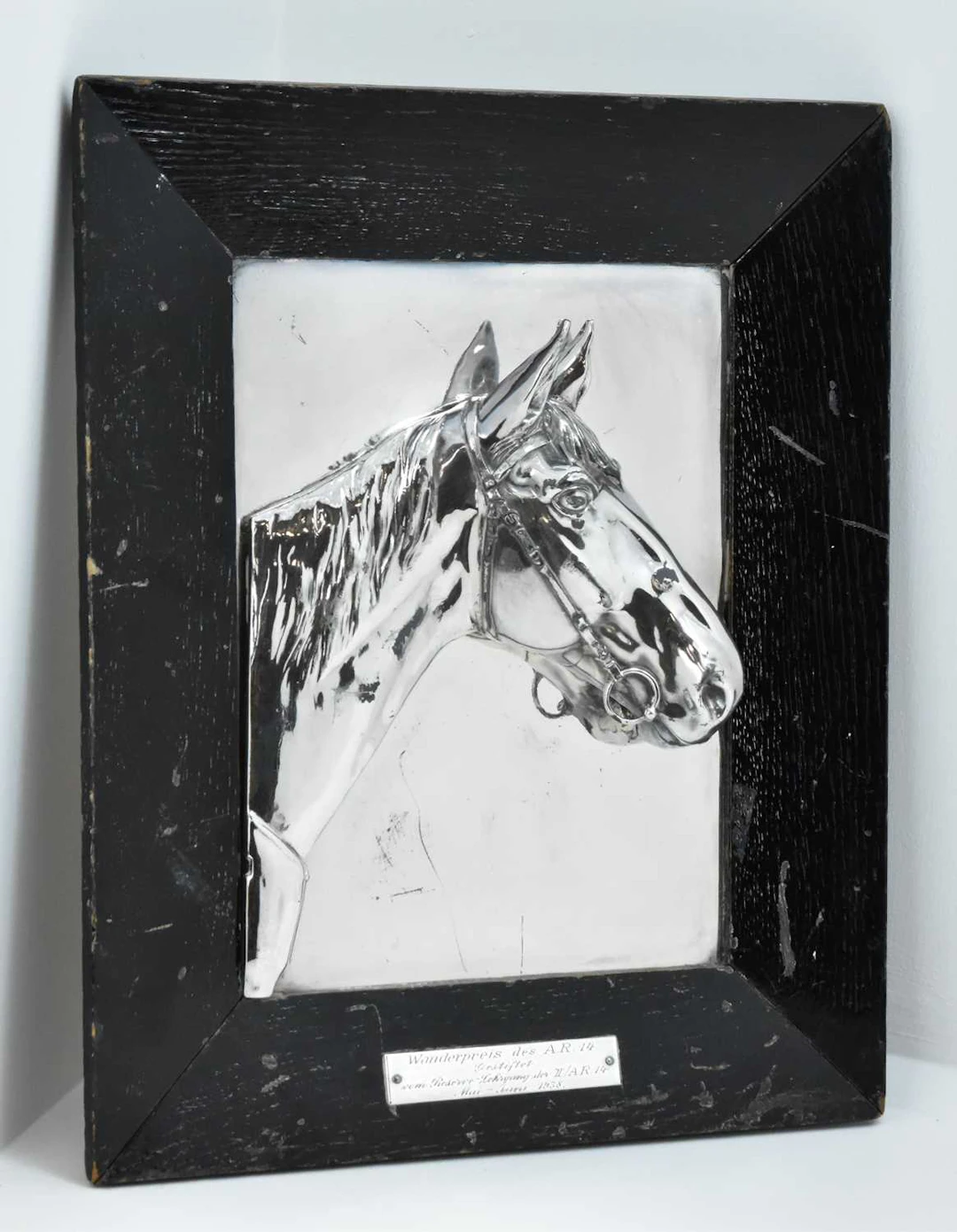 A 1938 wall plaque with a silver-plated horse's head and neck