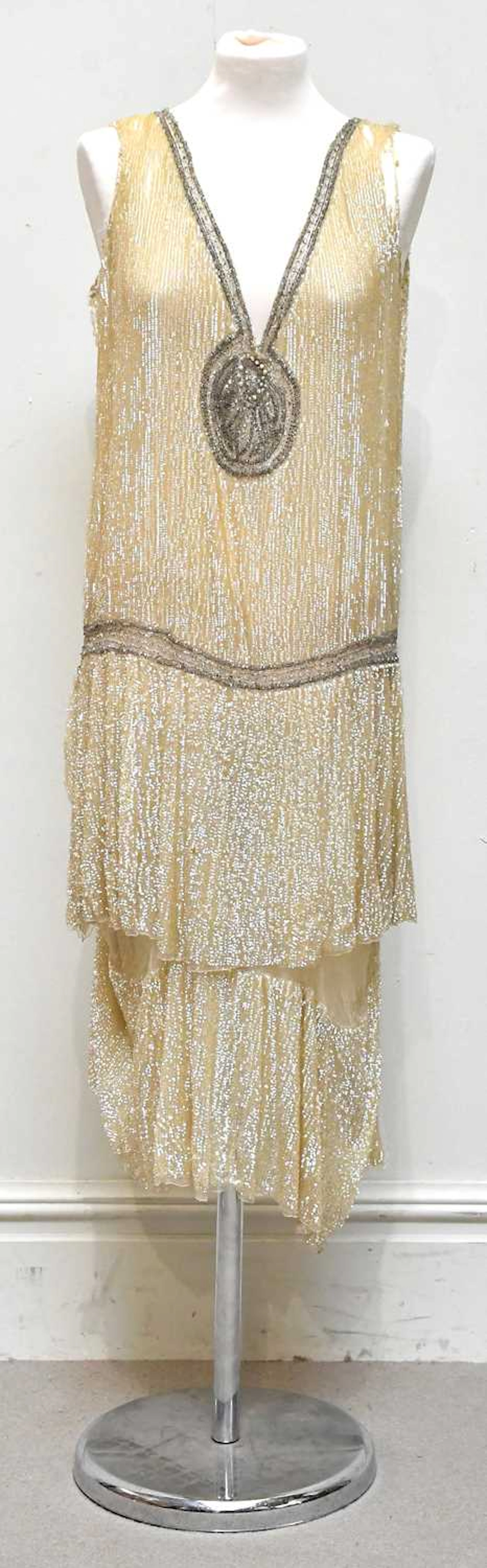 An original Art Deco 1920s evening flapper dress made with gold silk chiffon
