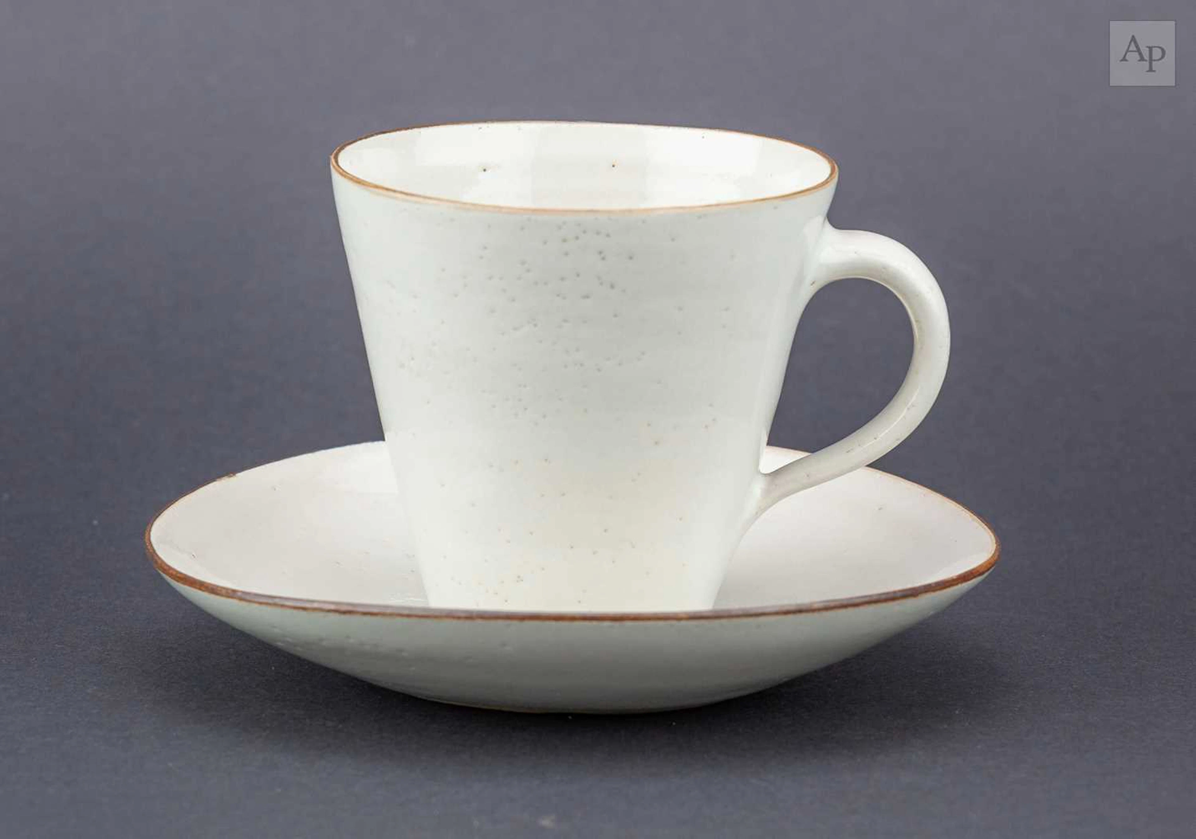 LUCIE RIE (1902-1995); a stoneware cup and saucer covered...