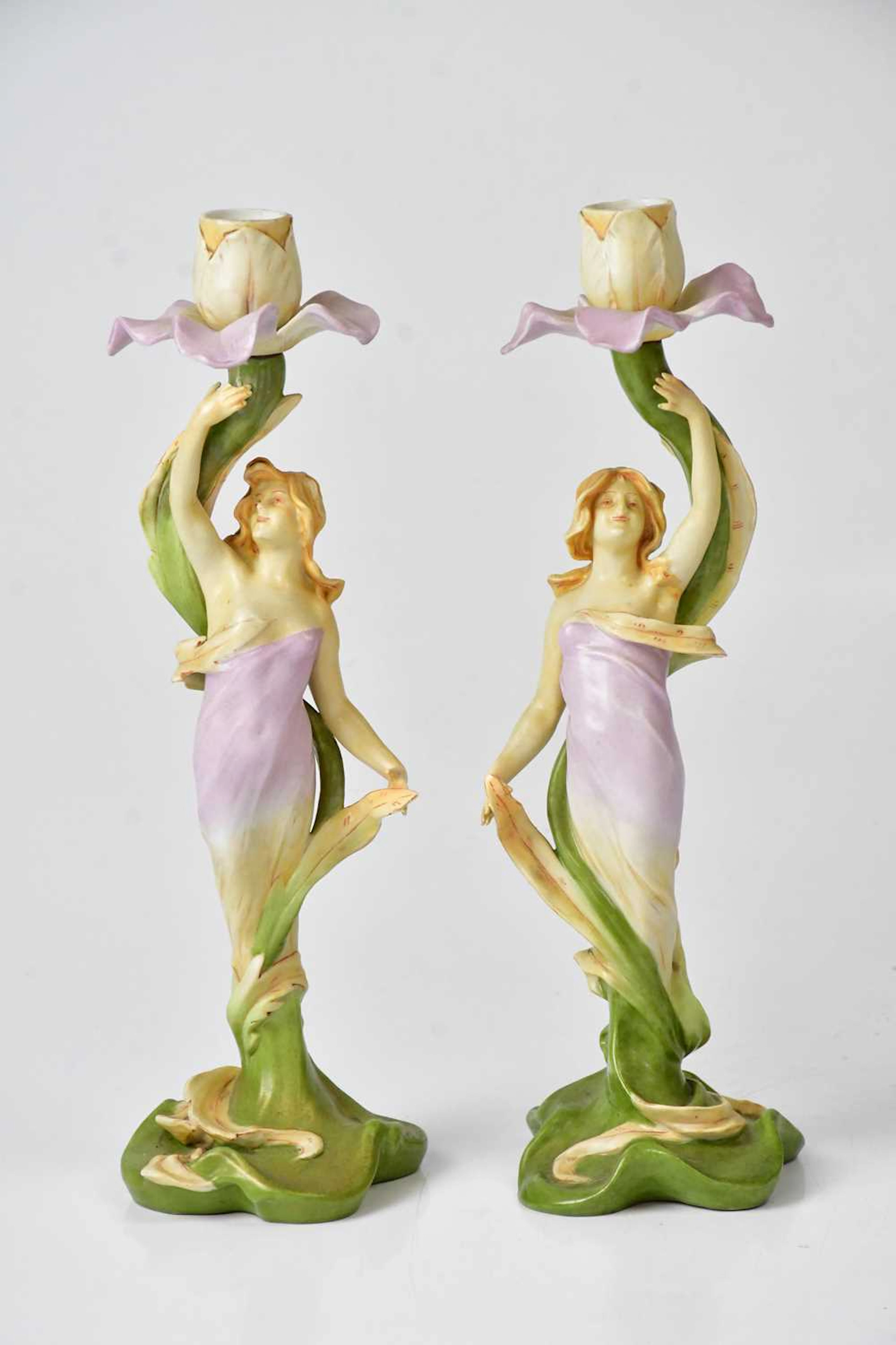 VOLKSTEDT; a pair of porcelain Art Nouveau candlesticks...