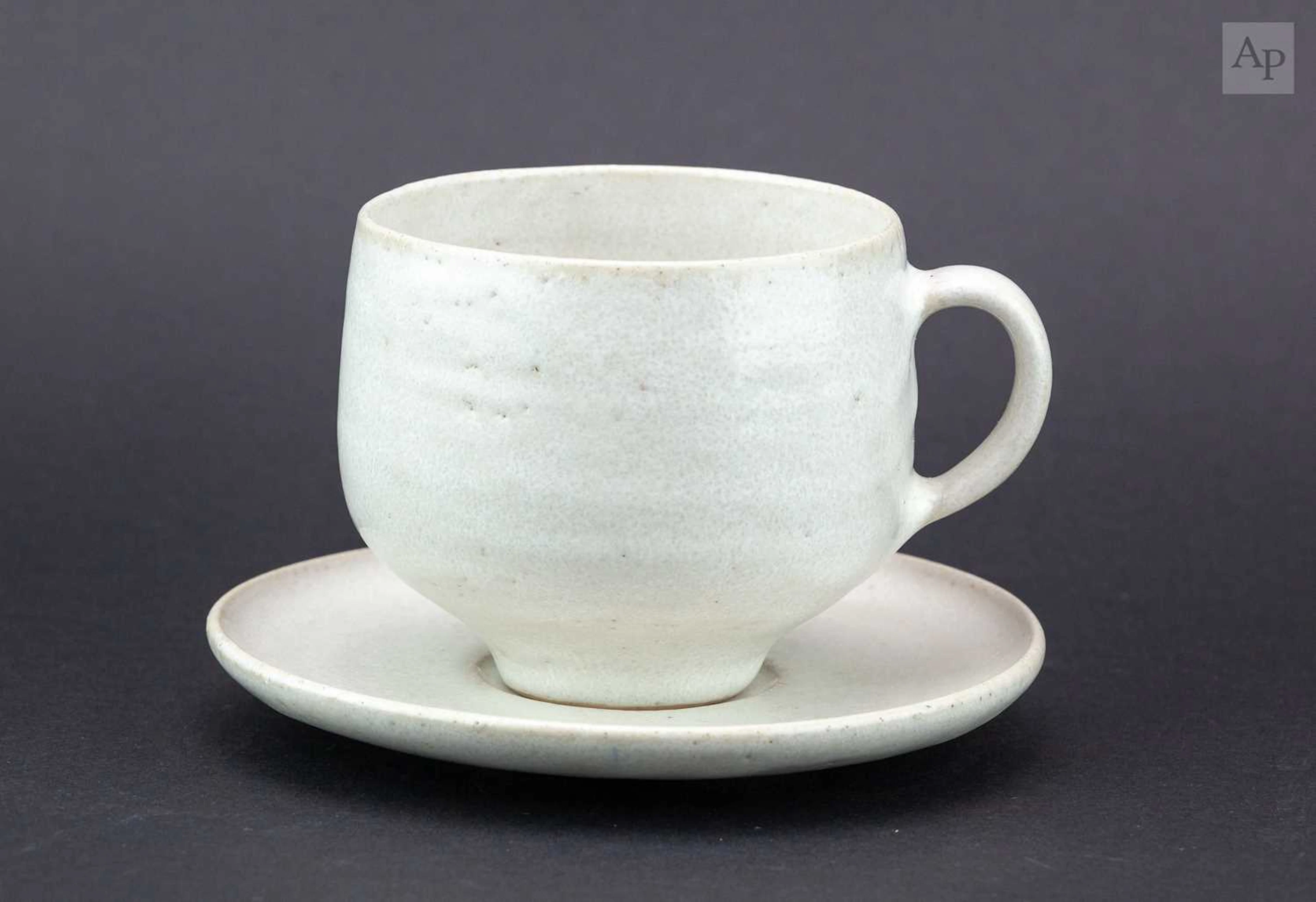 LUCIE RIE (1902-1995); a stoneware cup and saucer covered...