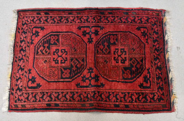 A small red ground rug