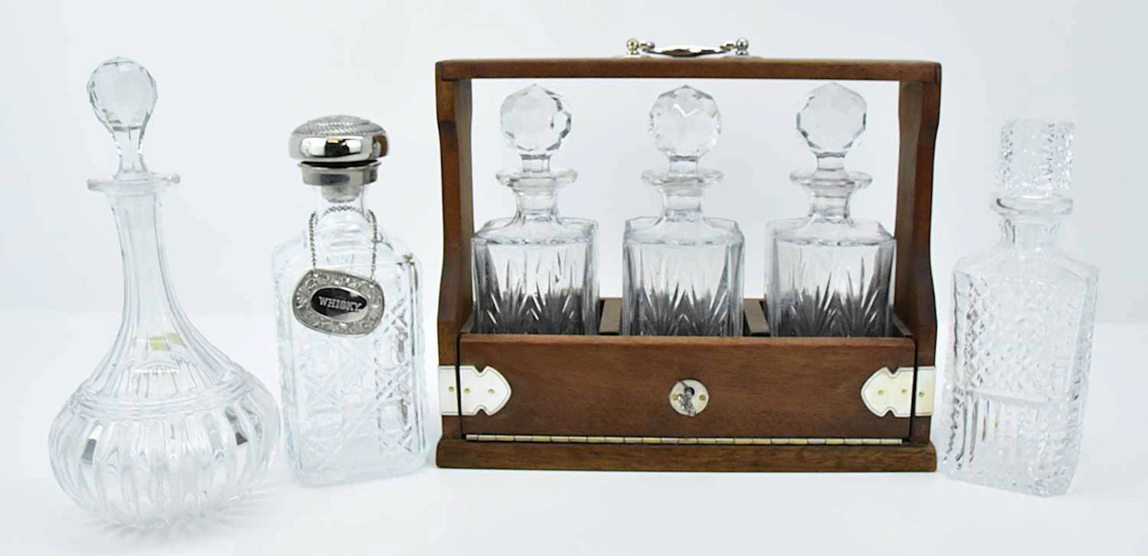A modern three-decanter oak framed tantalus