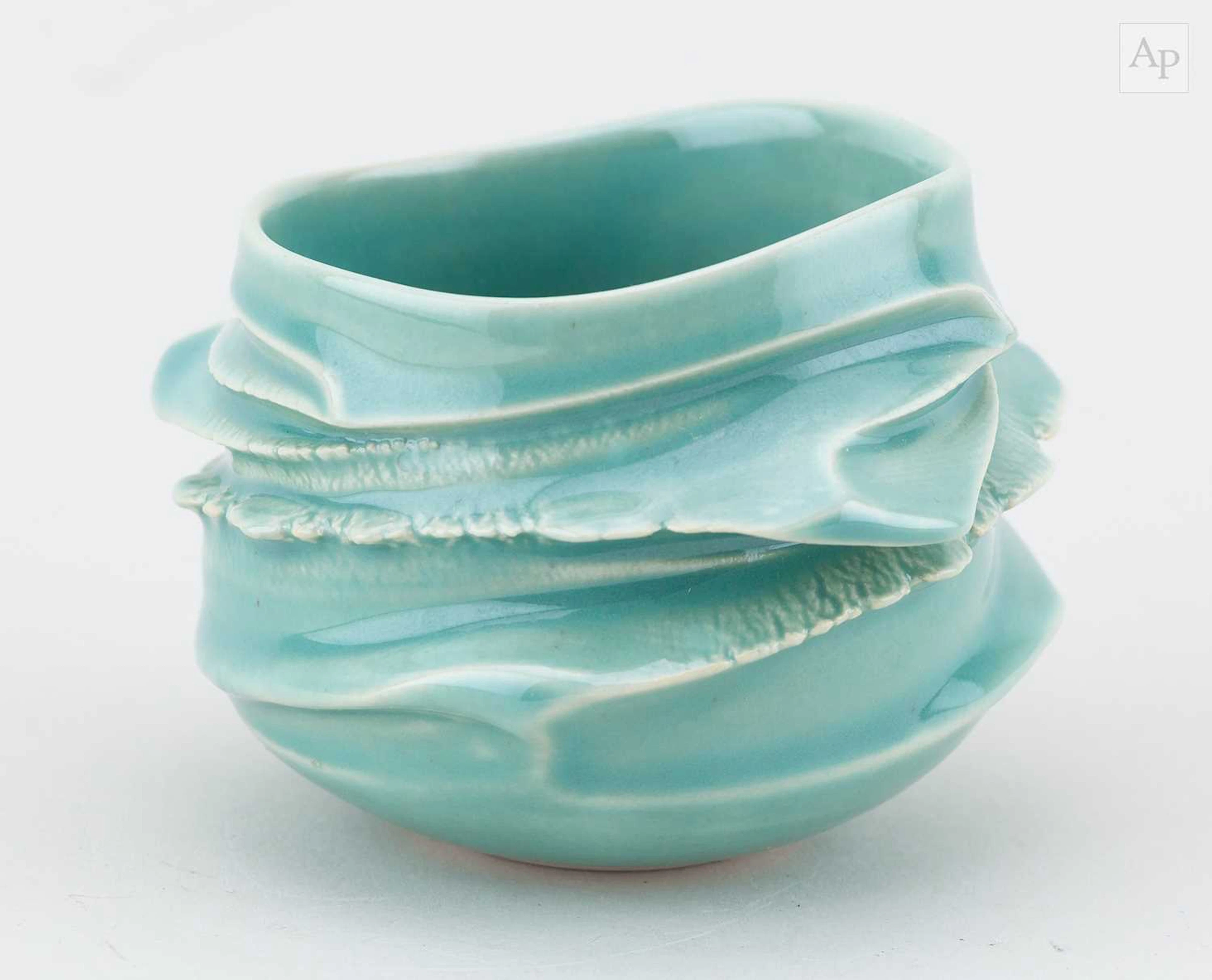 ASATO IKEDA (born 1979); a porcelain guinomi covered in celadon glaze
