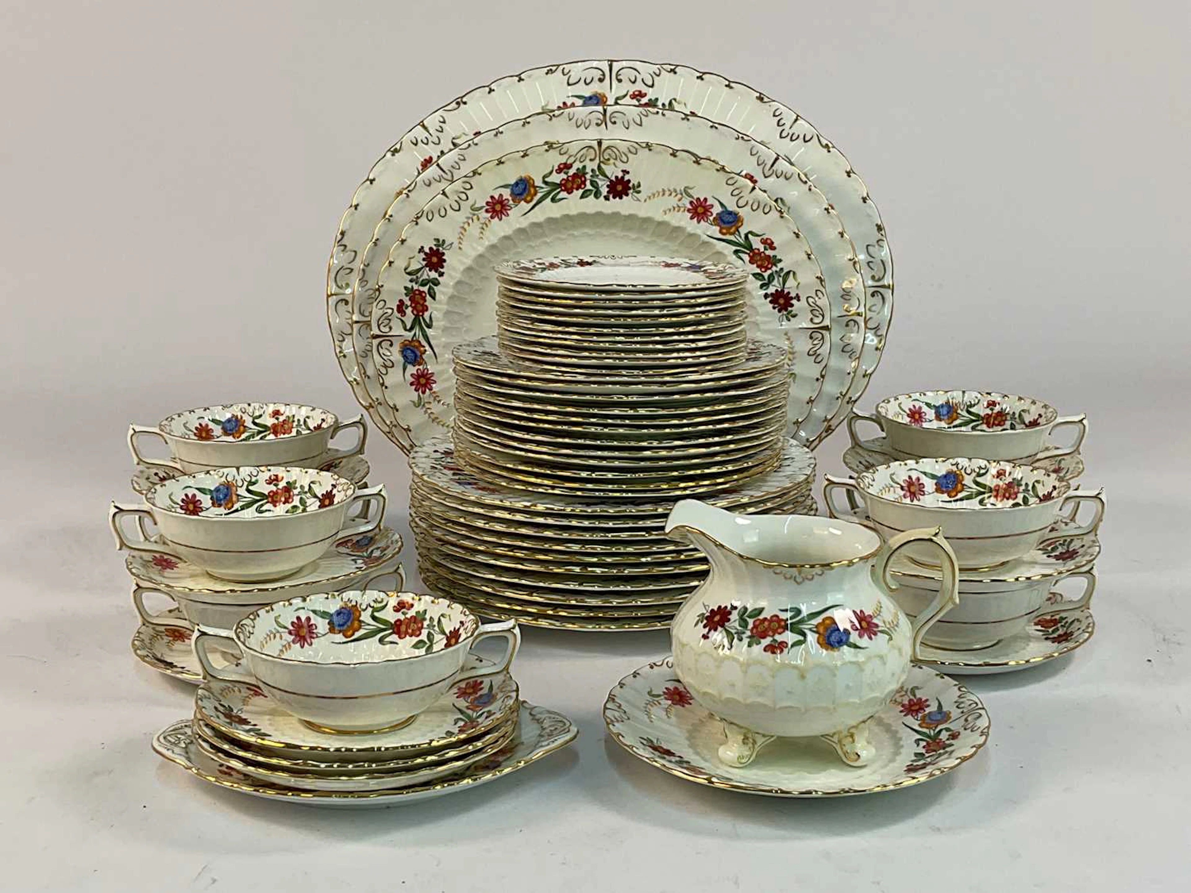 ROYAL CROWN DERBY; an extensive dinner service in the 'Chatsworth' pattern