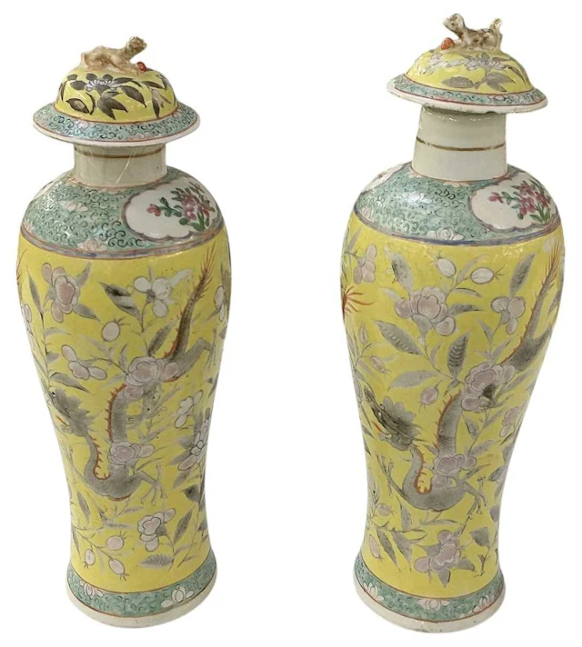 A pair of 19th century Chinese hand painted yellow ground porcelain lidded urns