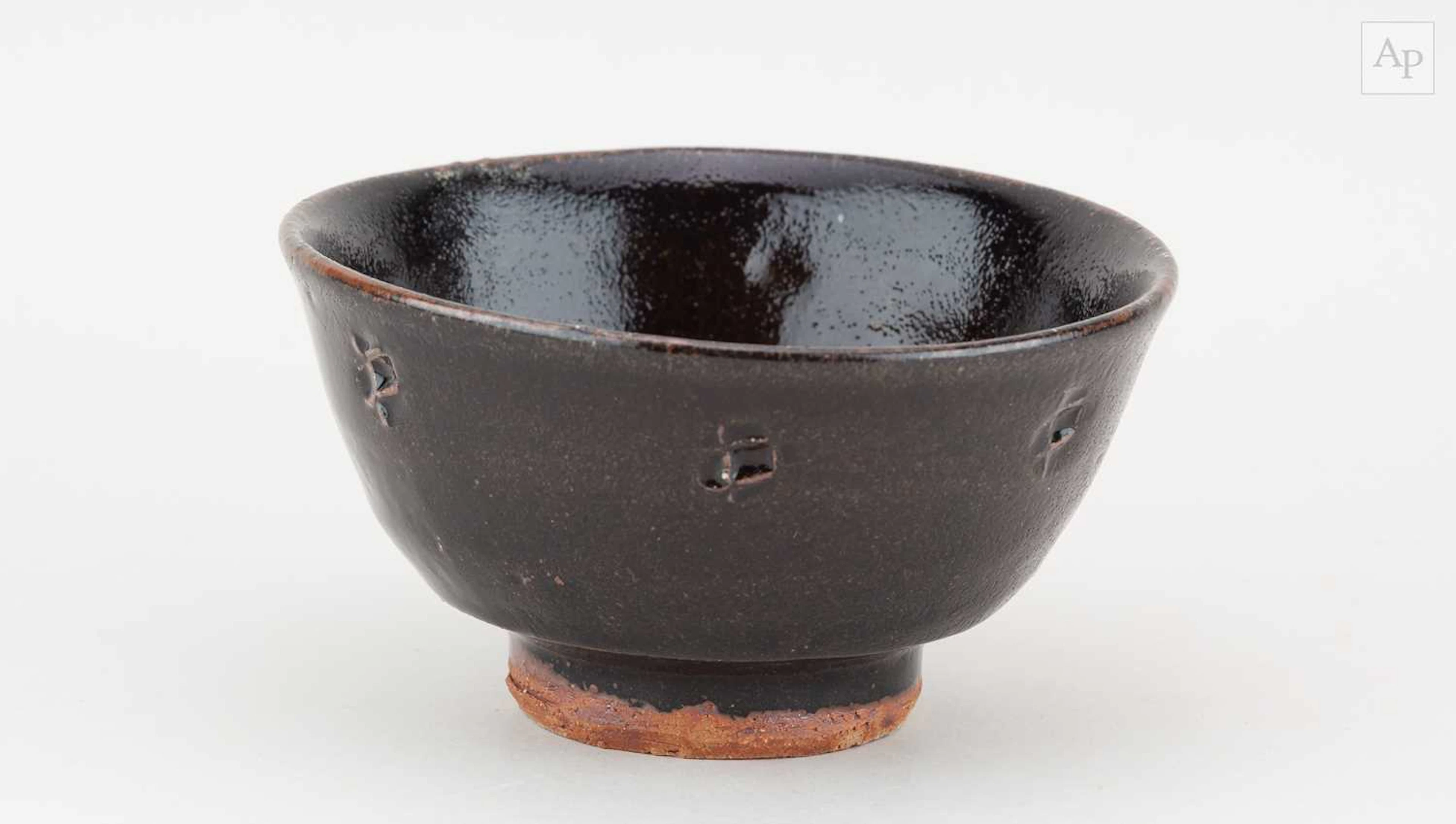 JIM MALONE (born 1946); a stoneware chawan covered in...