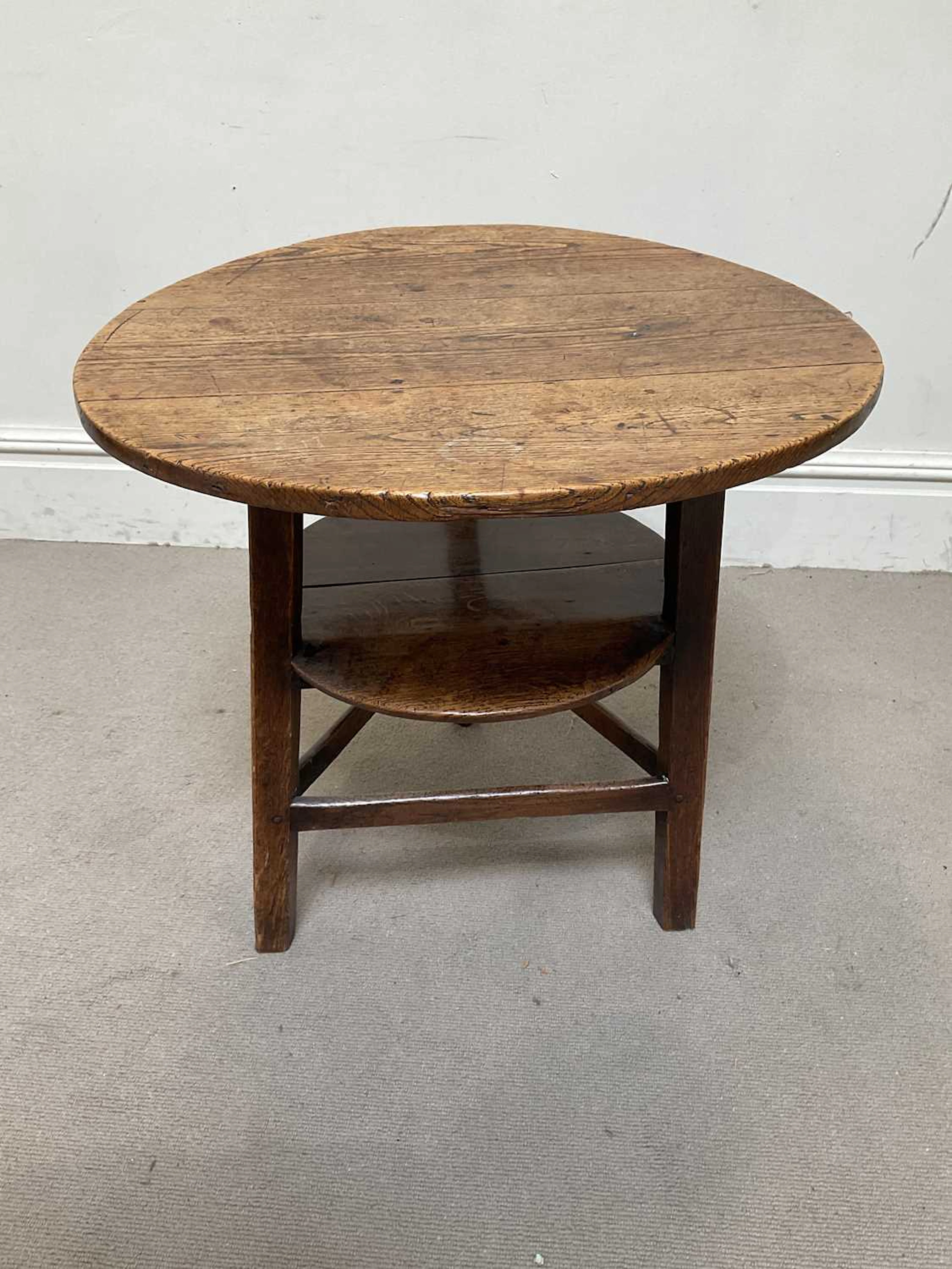 An 18th century vernacular oak cricket table