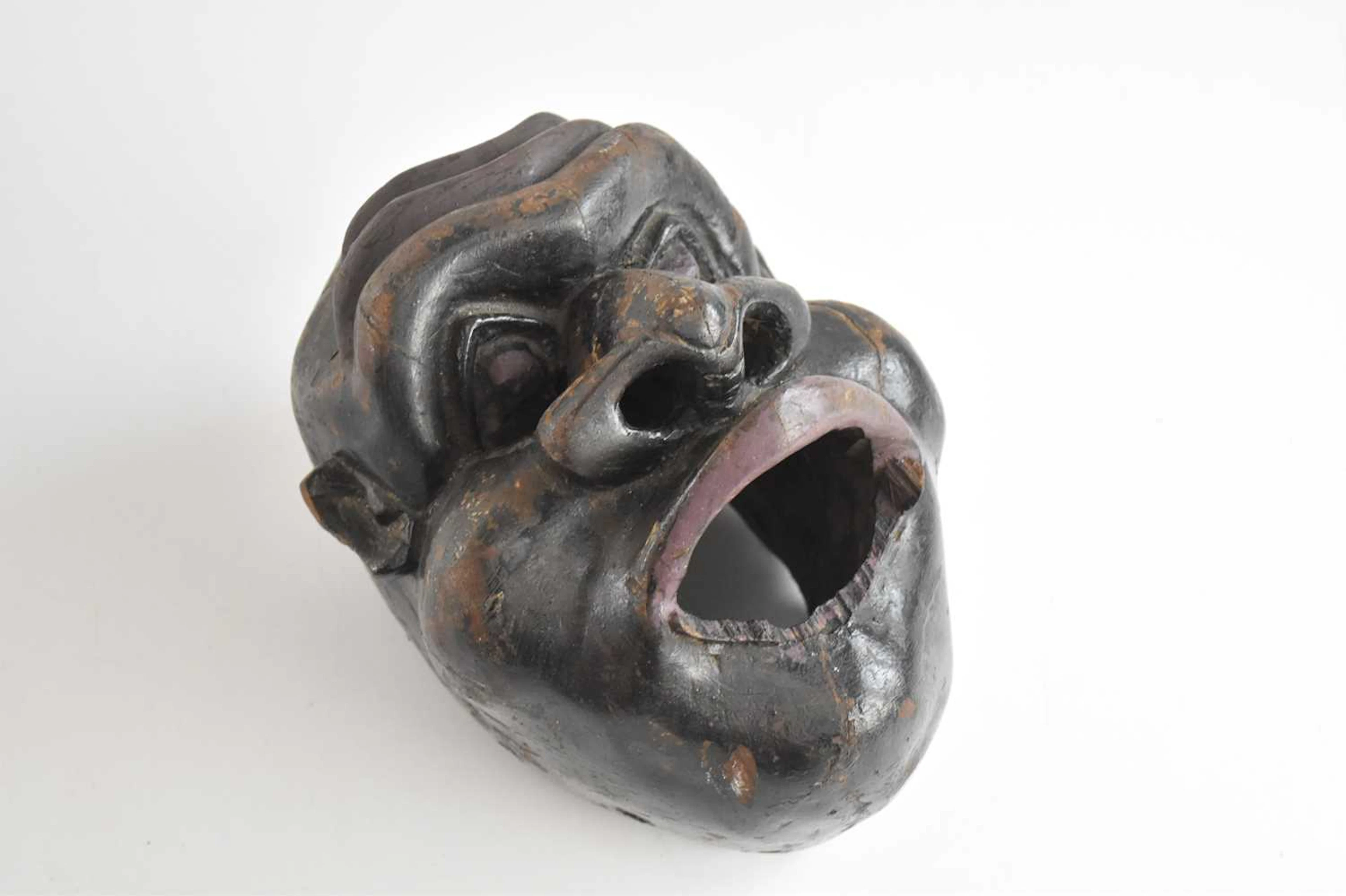 An unusual carved hardwood face mask