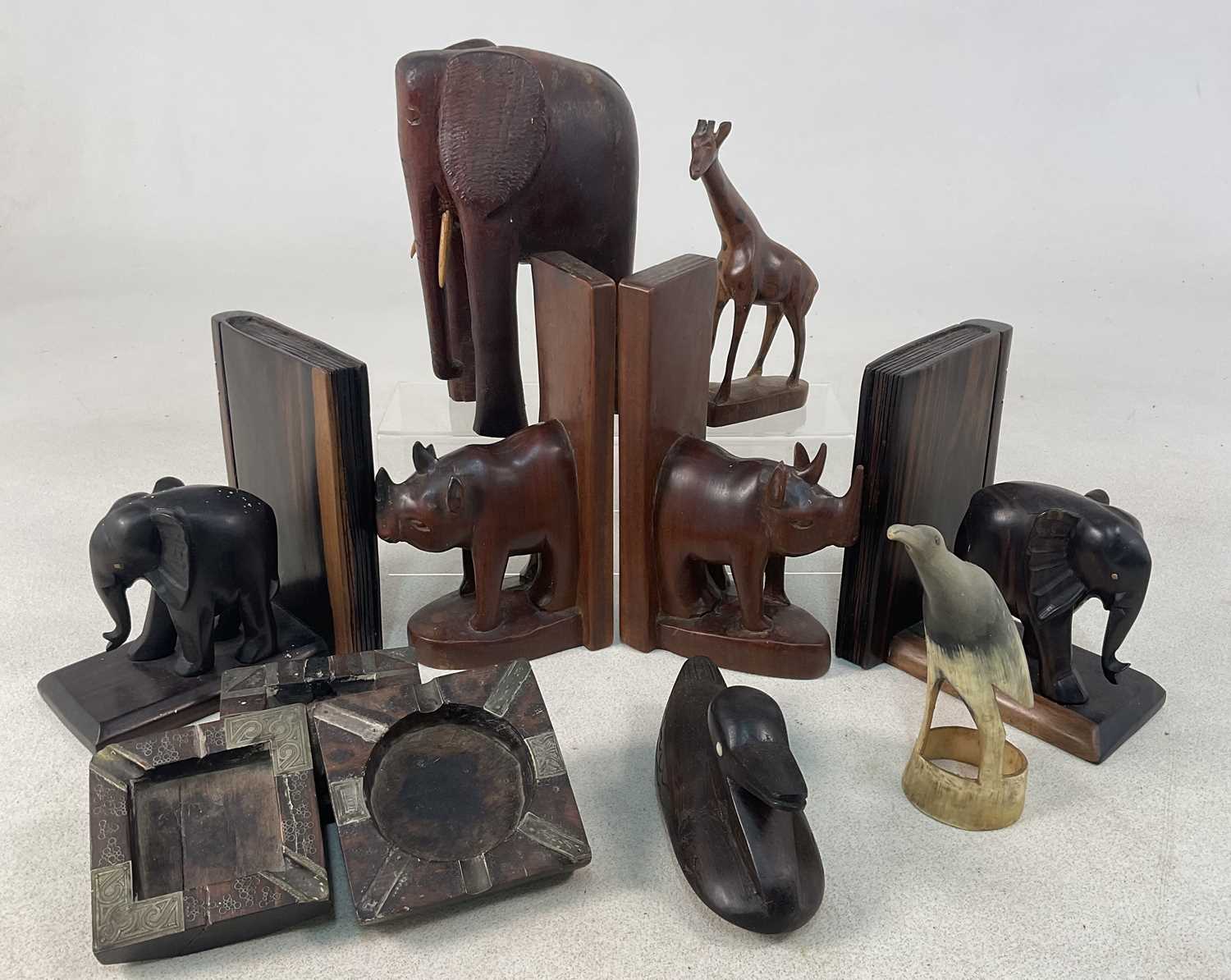 Two pairs of African hardwood elephant and rhinoceros book ends