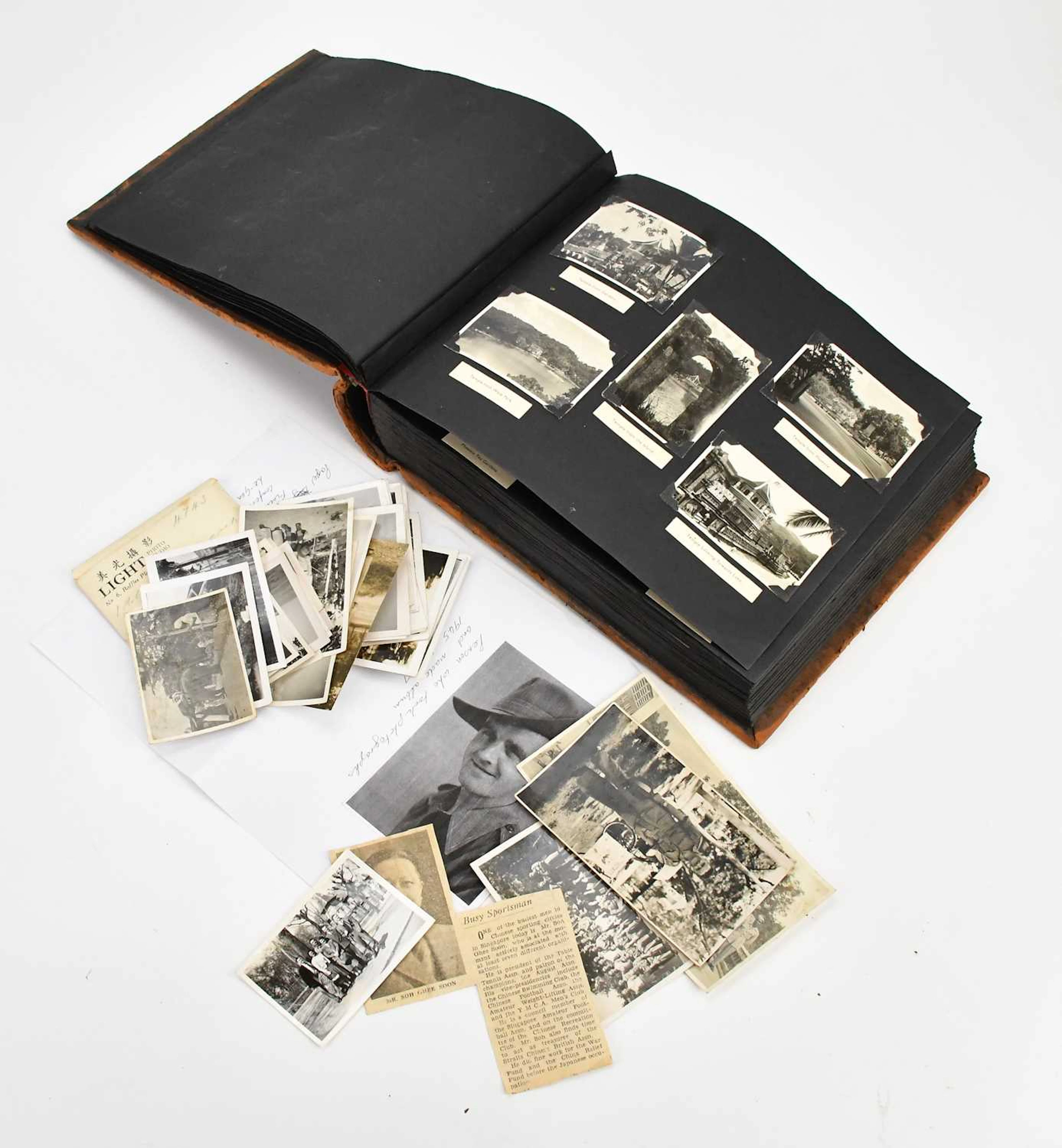 A photograph album containing images of Singapore