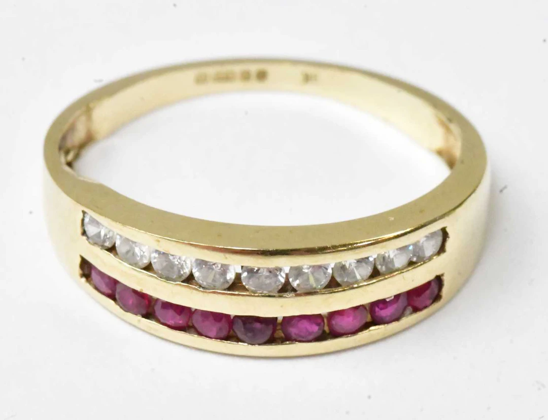 A 9ct yellow gold ring set with a row of white stones and a row of red stones
