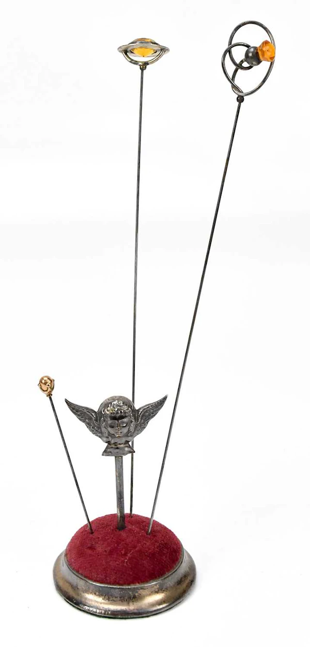 An Edward VII hallmarked silver pin cushion