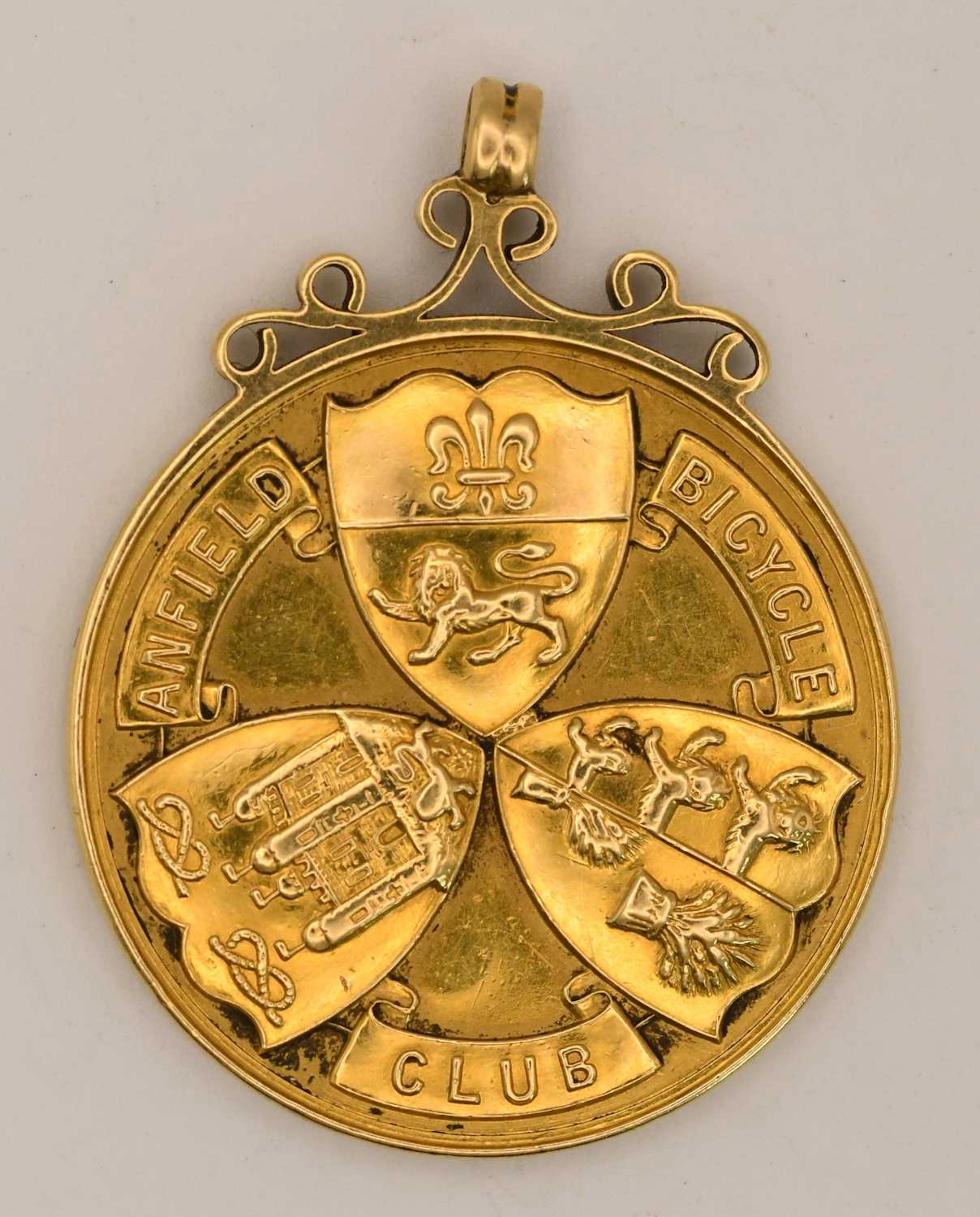 An 18ct yellow gold Anfield Bicycle Club prize fob