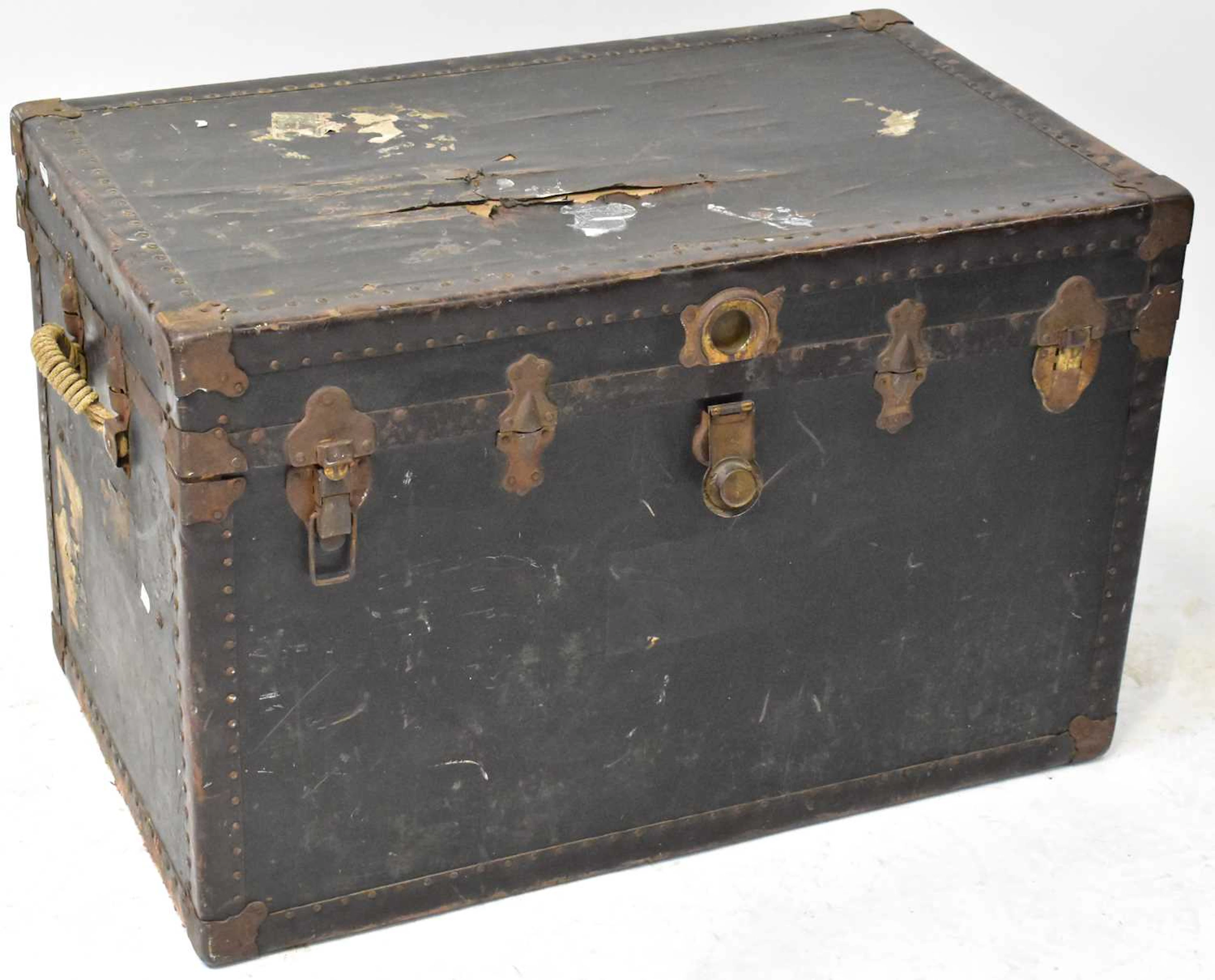 A vintage wooden steamer travelling trunk with studded...