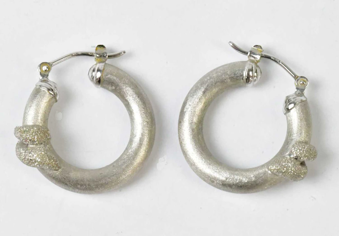 A pair of 18ct white gold hoop earrings with brushed texture