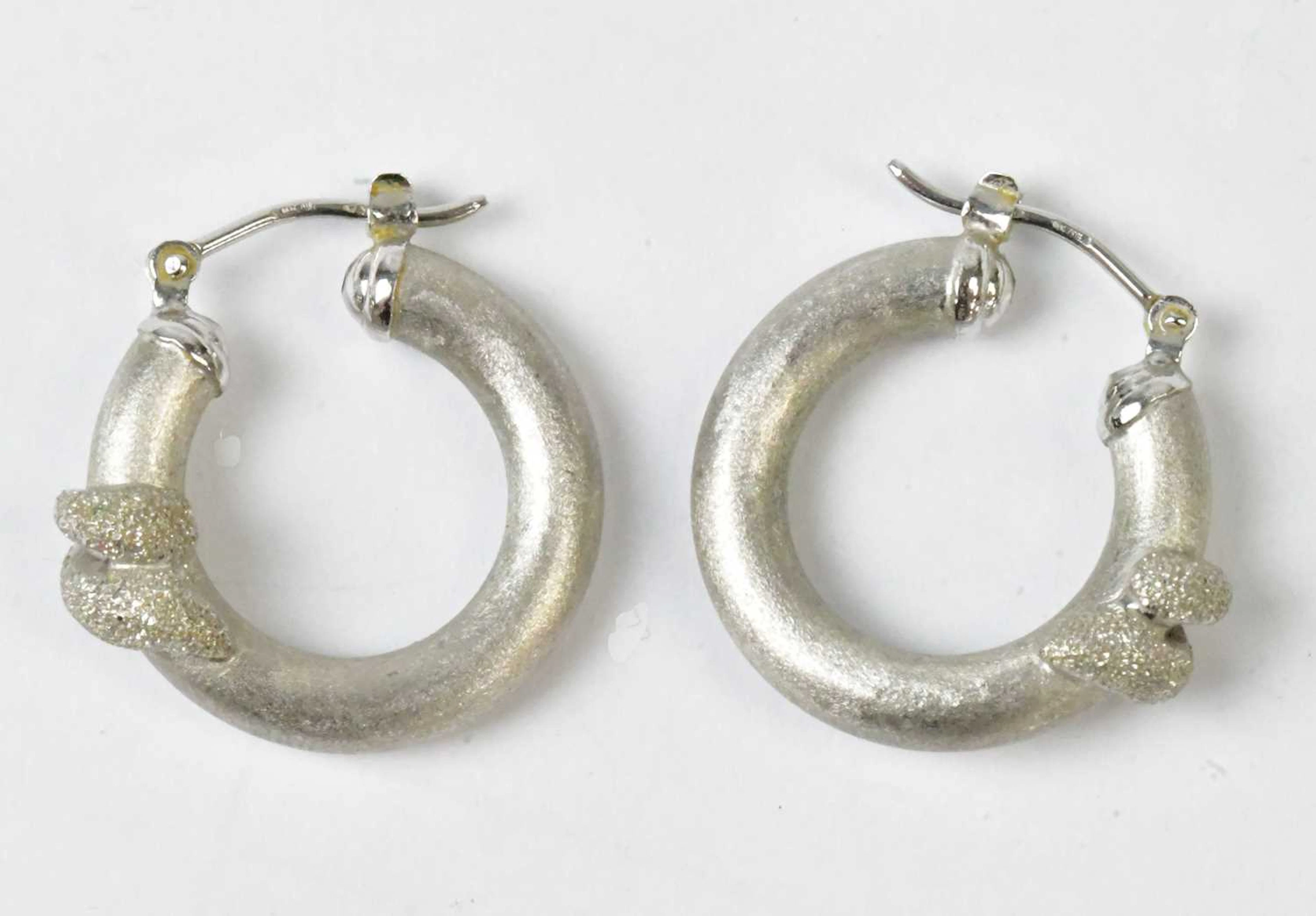 A pair of 18ct white gold hoop earrings with brushed texture
