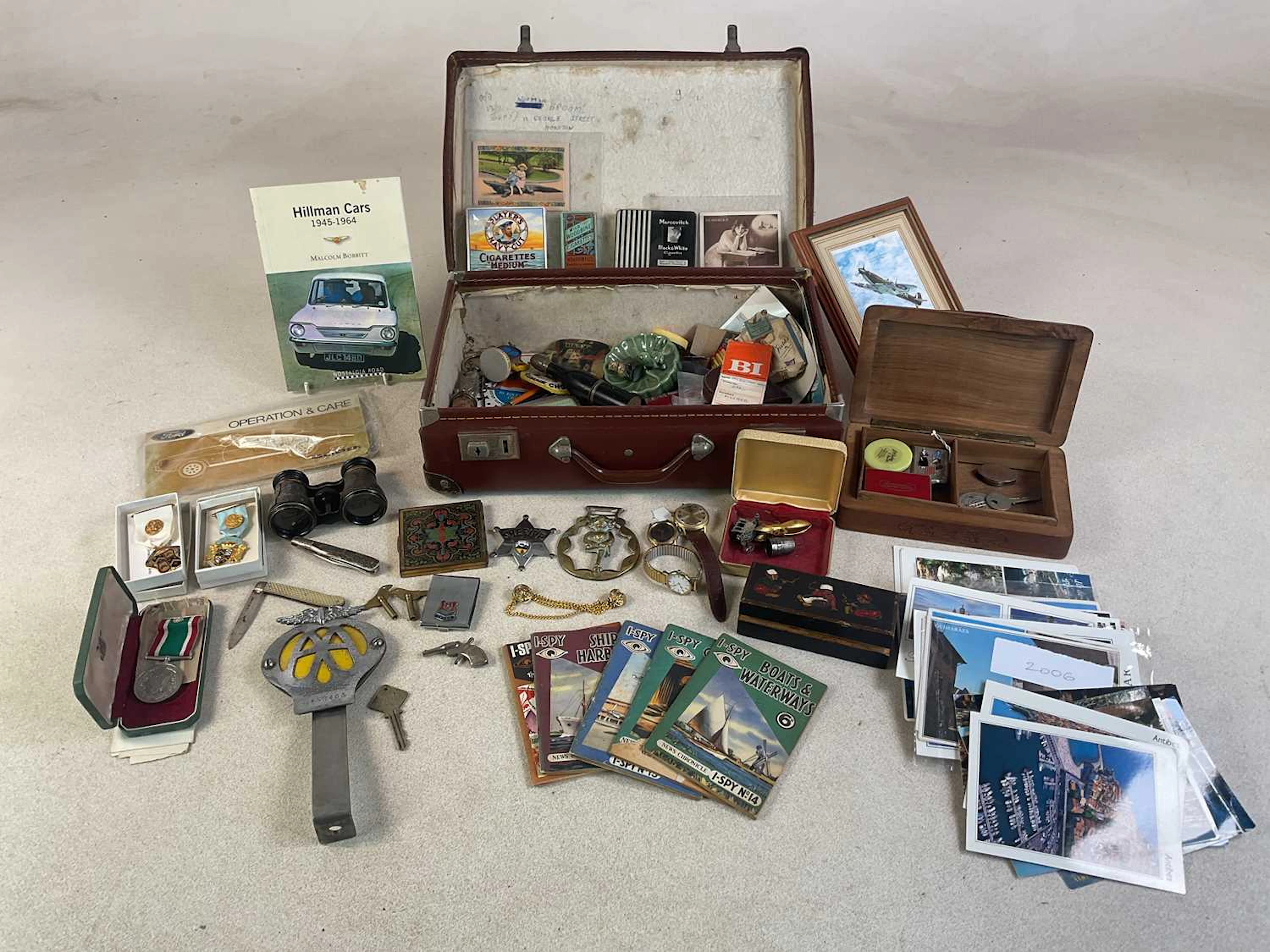 A small suitcase containing numerous collectors' items