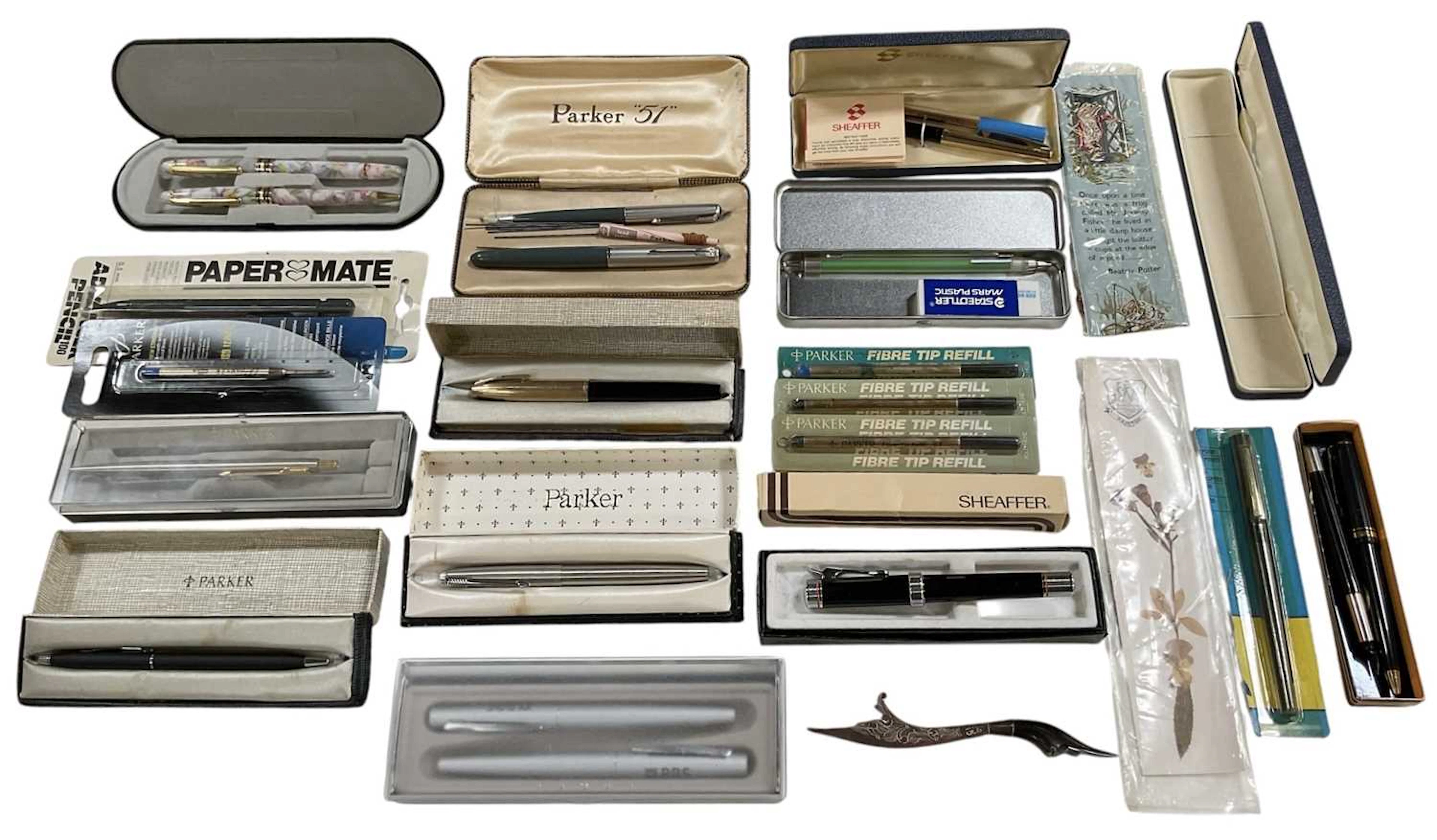 A large collection of assorted pens and fountain pens