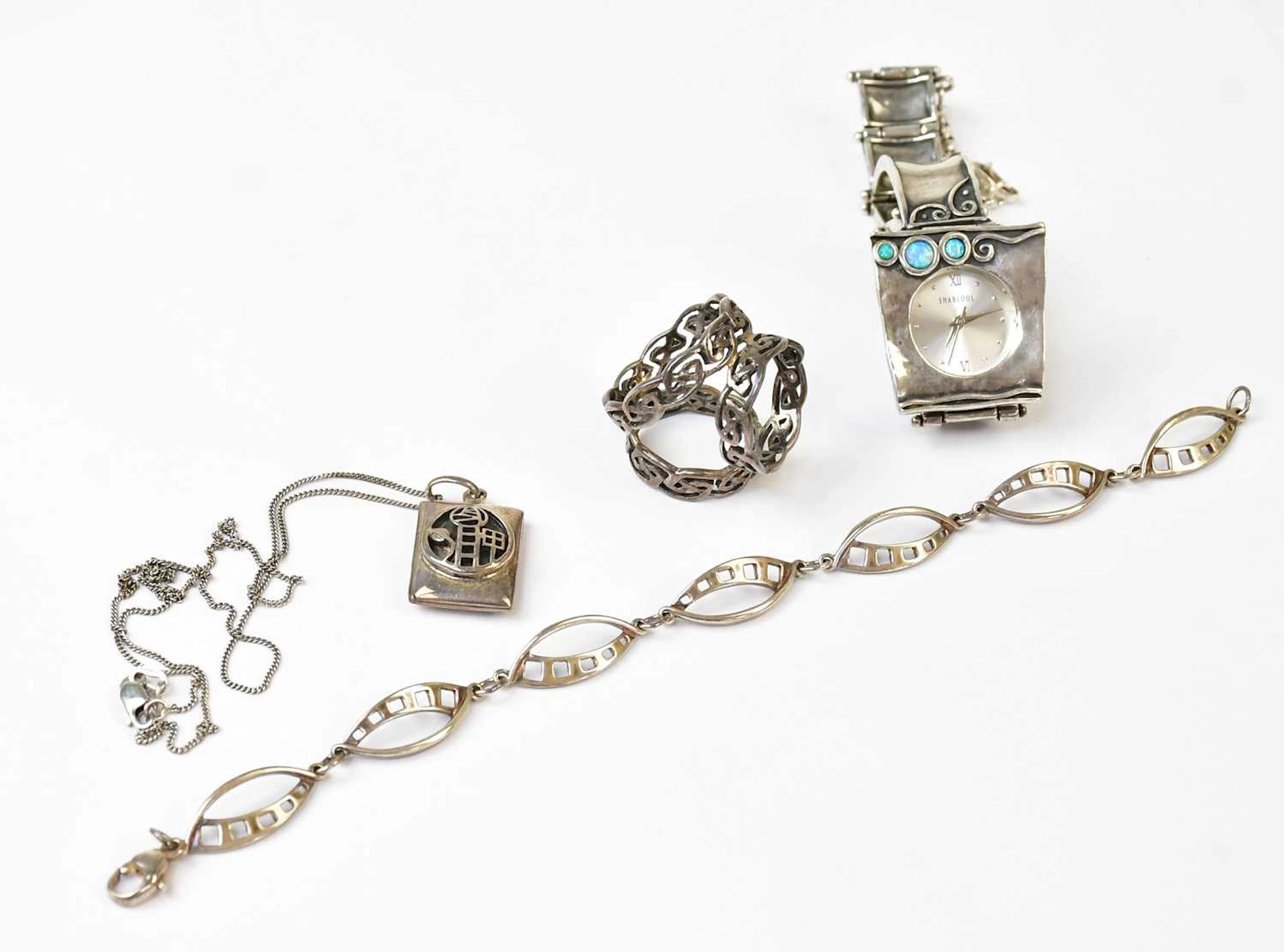 A boxed Charles Rennie Mackintosh silver locket on a fine chain