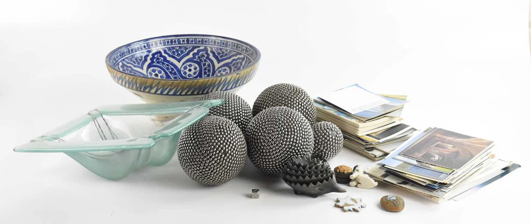 An Iznik type footed bowl with blue and white scrolling decoration